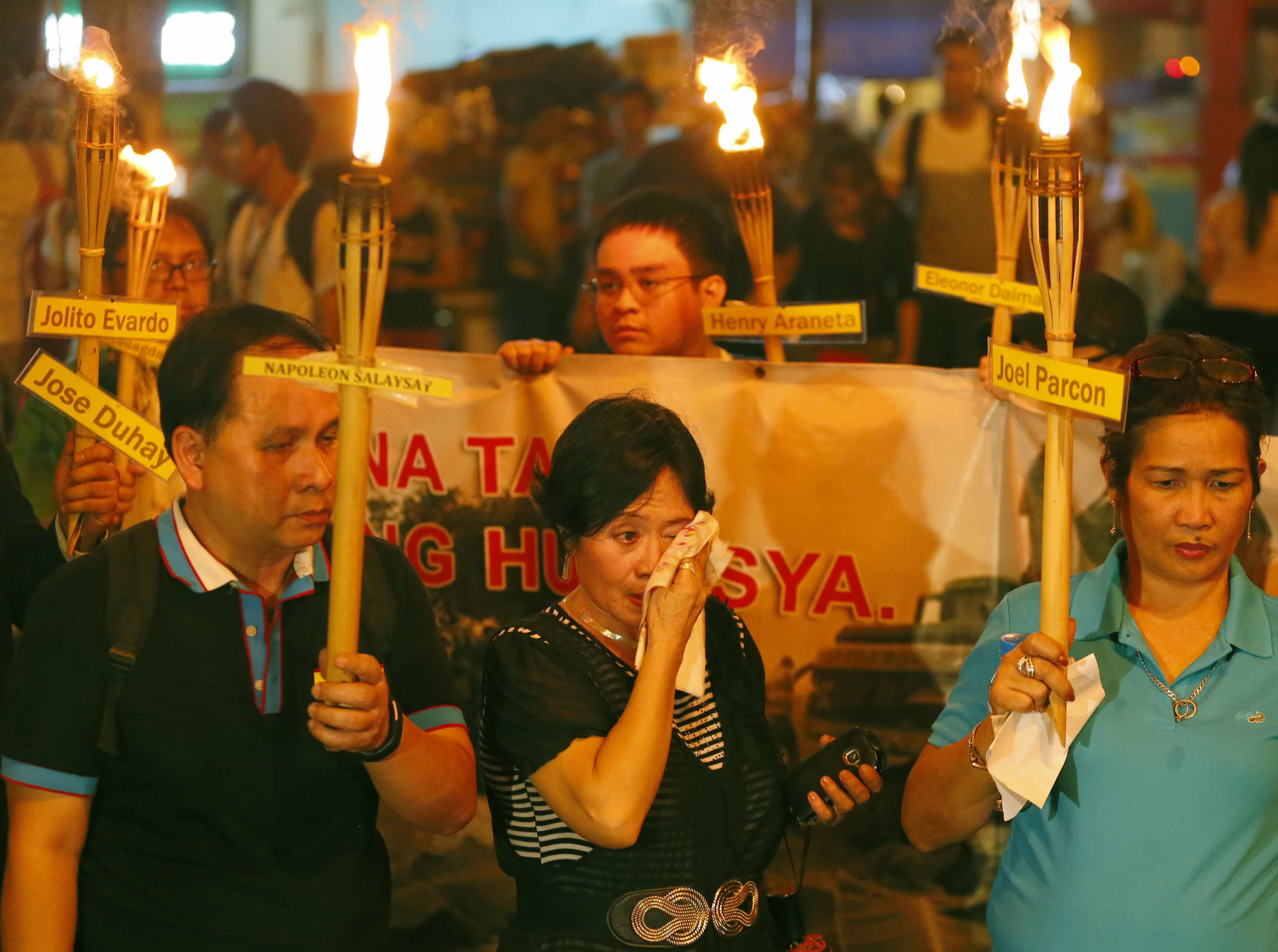 Ramonita Salayasay, widow of journalist Napoleon Salaysay, wipes her tears during commemoration of the killings of journalists in Maguindanao province 6 years earlier, near the Presidential Palace in Manila, 23 November 2015 , AP Photo/Bullit Marquez