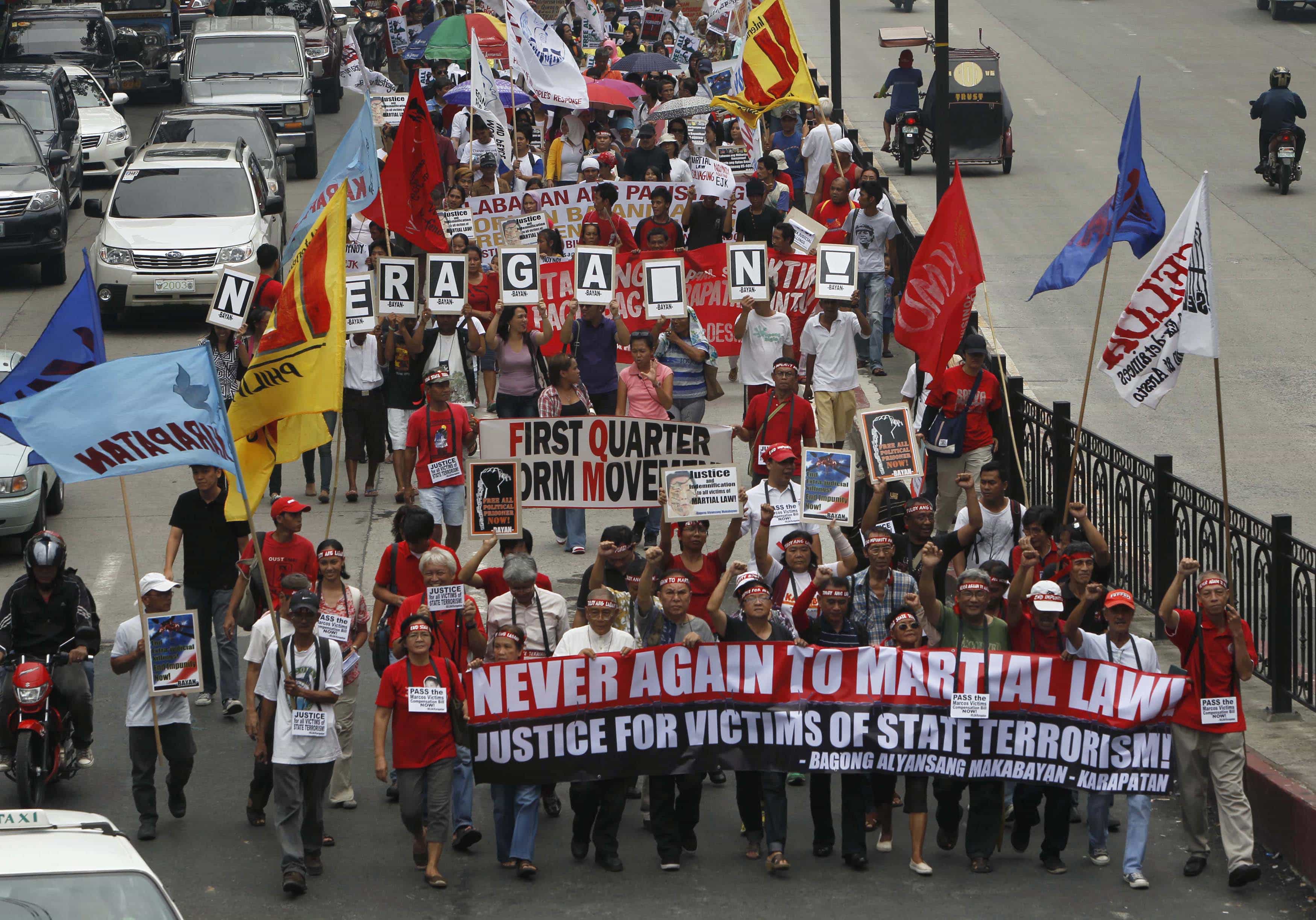 Protesters march towards the presidential palace in Manila 21 September 2012 to commemorate the 40th anniversary of martial law declaration. , REUTERS/Romeo Ranoco