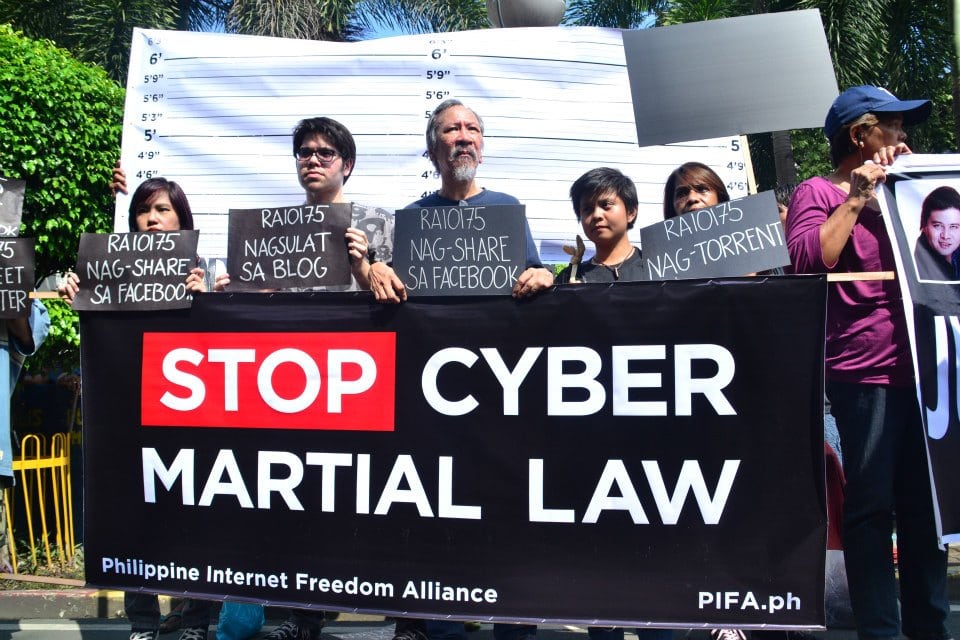 "Cybercriminals" pose for mugshots during the Black Tuesday 2.0 demonstrations in front of the Supreme Court on 9 October 2012, Irish Flores, Philippine Internet Freedom Alliance