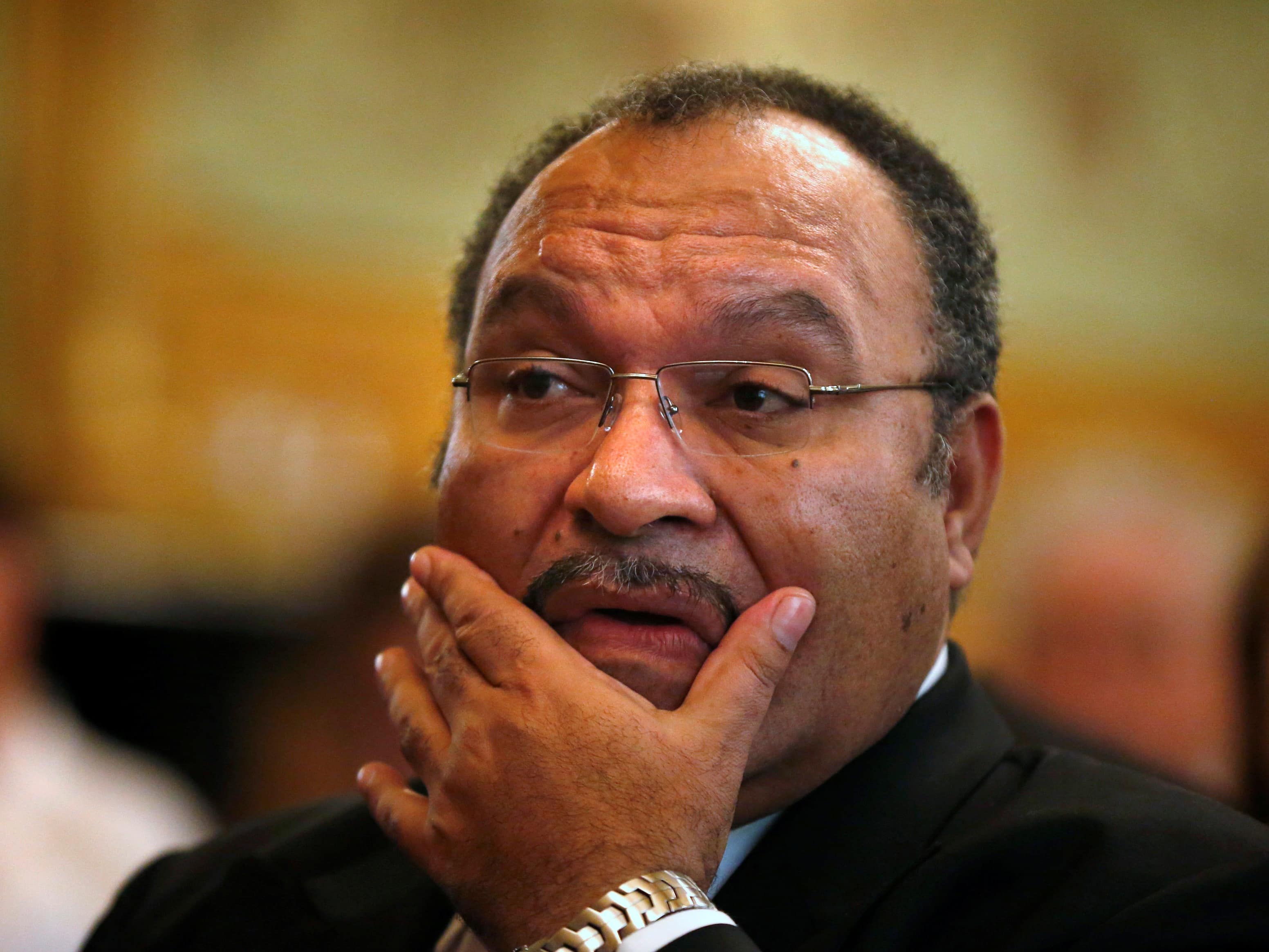 Papua New Guinea's Prime Minister Peter O'Neill pauses before making an address in Sydney, 29 November 2012, REUTERS/Tim Wimborne