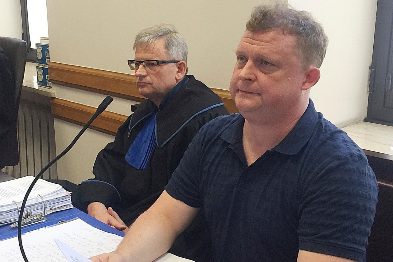 Tomasz Piatek, right, a journalist for the Polish newspaper "Gazeta Wyborcza", sits alongside his lawyer in a court in Warsaw, Poland, 21 June 2017, AP Photo/Vanessa Gera