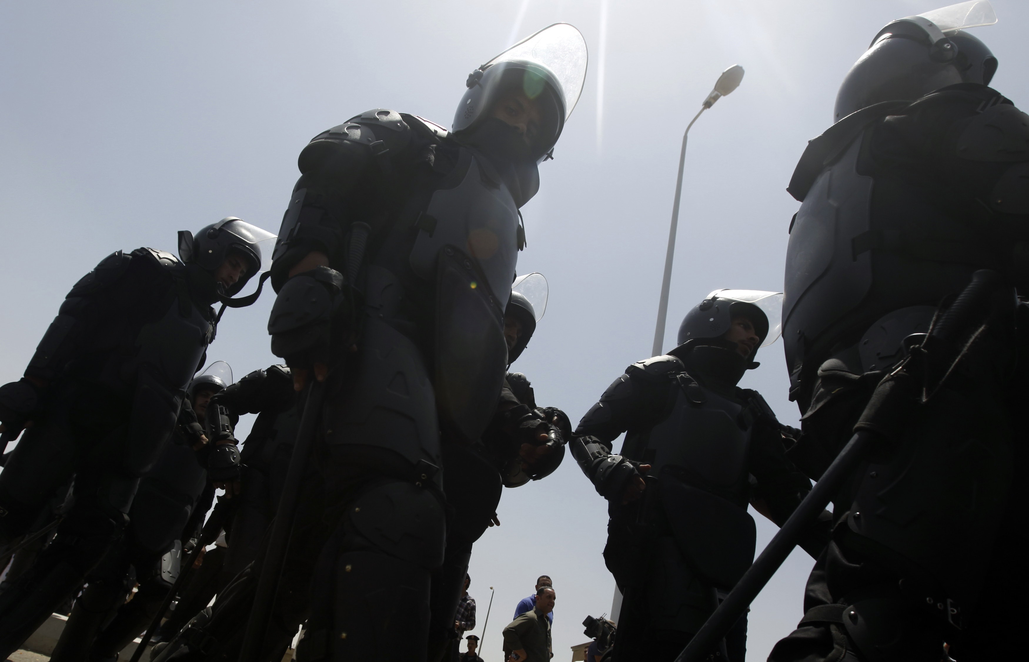 Police officers take up positions outside the police academy, where the trial of Egypt's former president Hosni Mubarak was taking place in Cairo on 11 May 2013, REUTERS/Amr Abdallah Dalsh