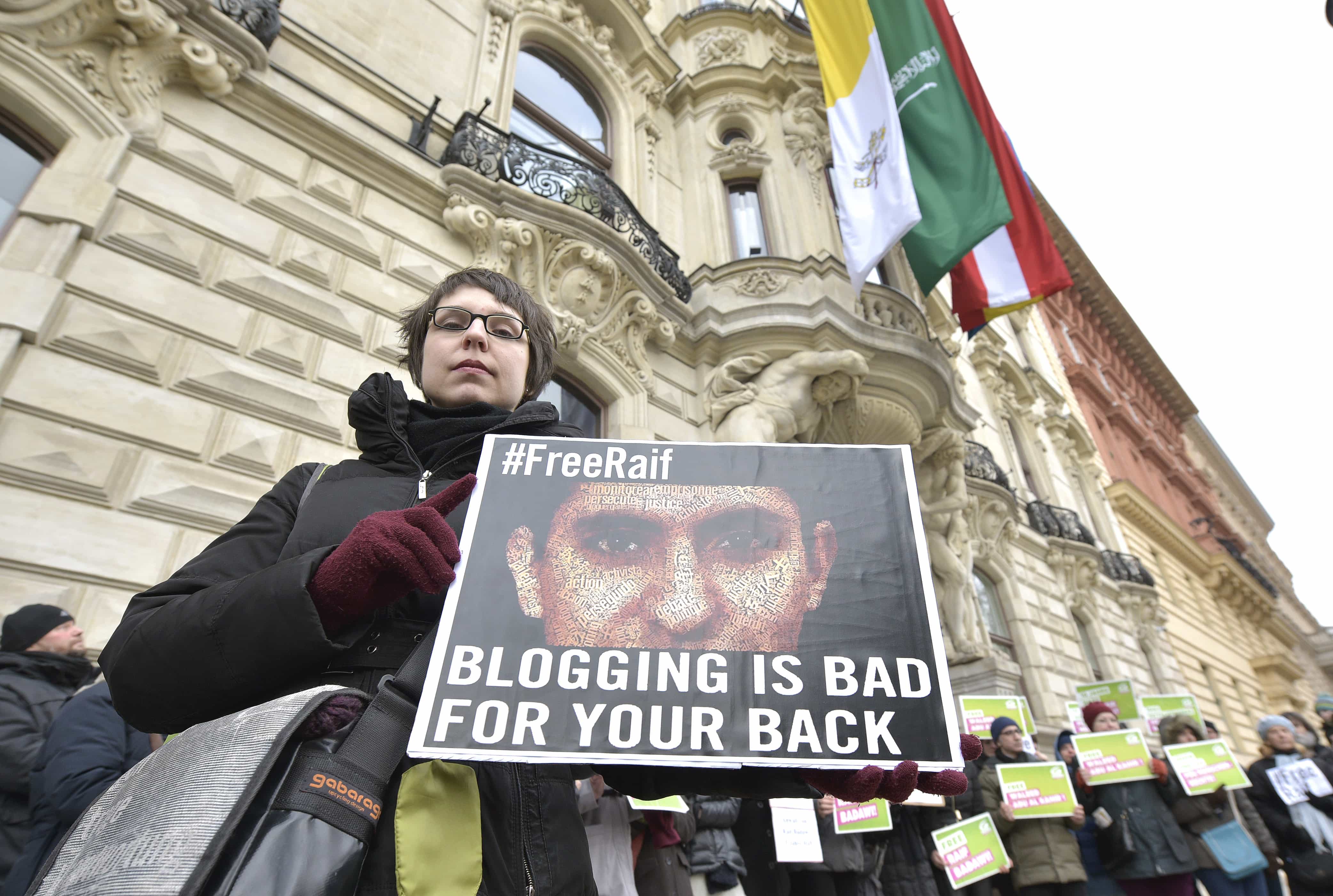 In this picture taken 6 February 2015, members of the Austrian Greens attend a protest against the punishment of jailed Saudi blogger Raif Badawi, AP Photo/Hans Punz
