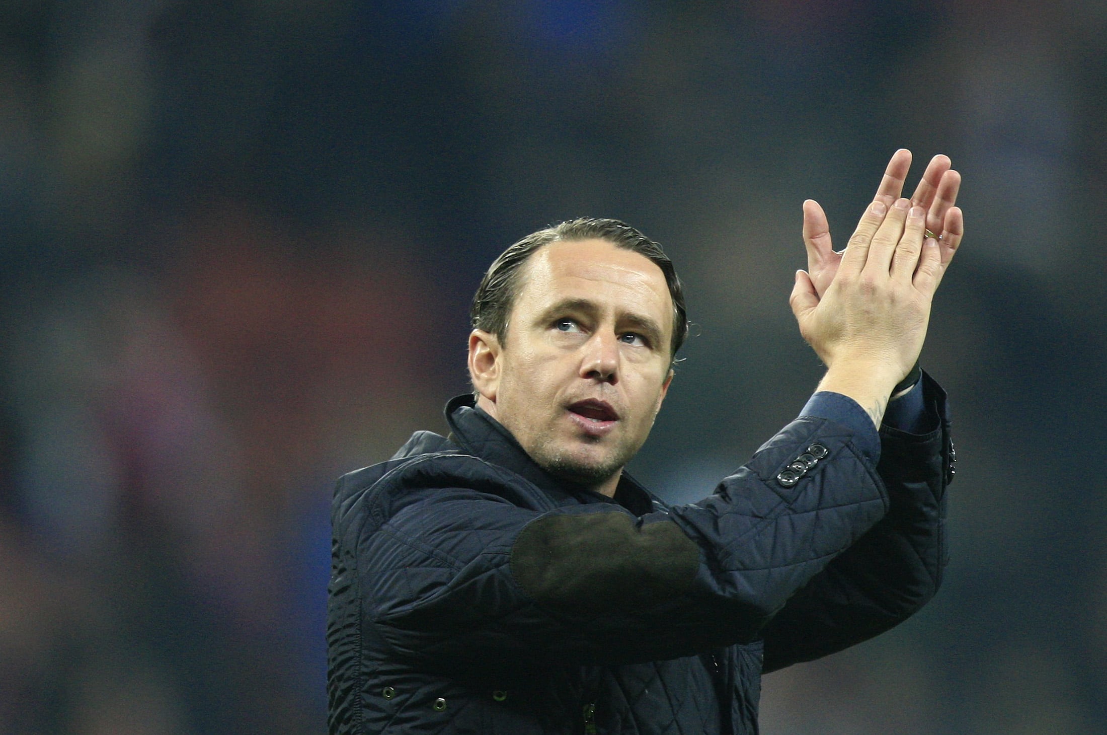 Steaua Bucharest's head coach Laurentiu Reghecampf acknowledges the crowd a football match on 7 March 2013. According to ActiveWatch, Reghecampf threatened journalists in August 2012., REUTERS/Radu Sigheti