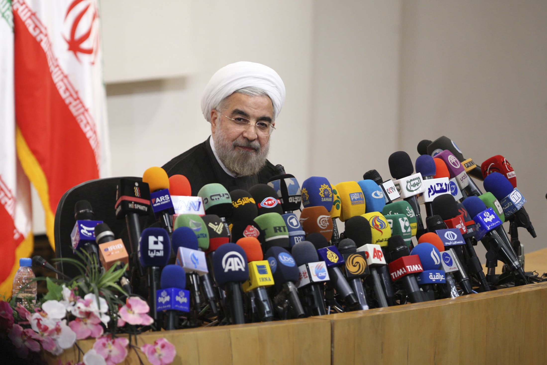 Iranian President-elect Hassan Rohani speaks with the media during a news conference in Tehran on 17 June 2013, REUTERS/Fars News/Majid Hagdost