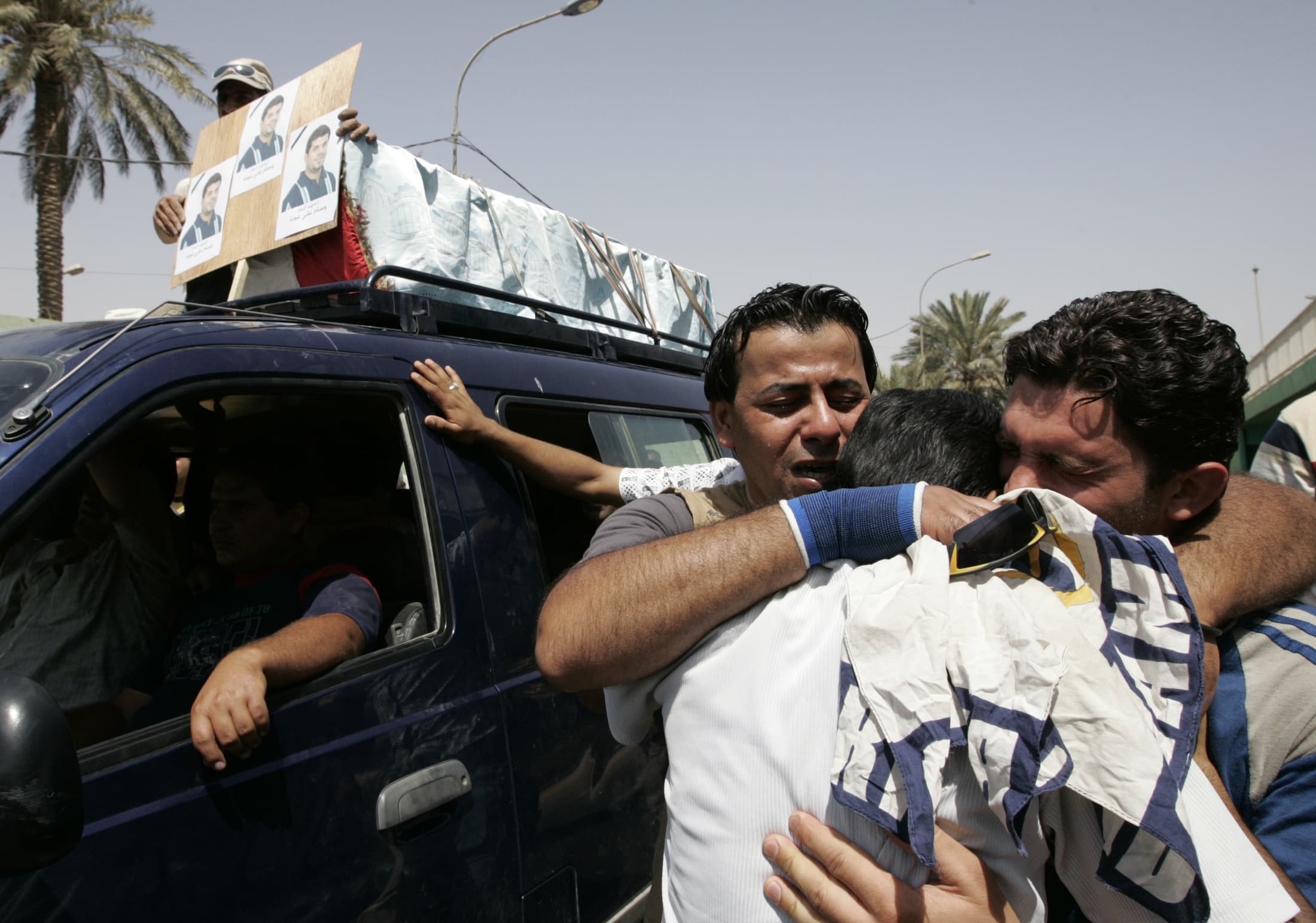 Iraqi journalists grieve on 22 May 2008 during a funeral for a television cameraman who was among 11 people killed in Baghdad by the US military, REUTERS/Mohammed Ameen