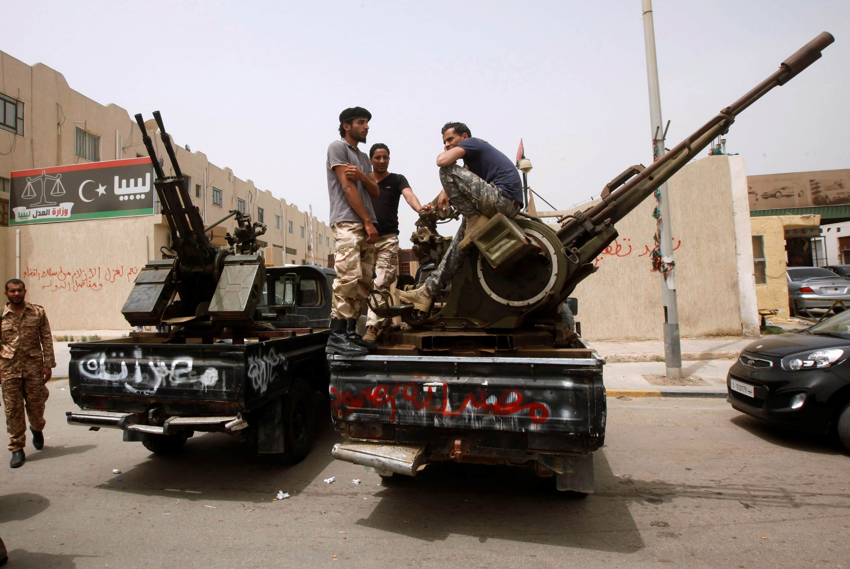 Gunmen in pick-up trucks surrounded Libya's justice ministry on 30 April 2013 to step up demands for former aides to deposed dictator Muammar Gaddafi to be barred from senior government posts, REUTERS/Ismail Zitouny