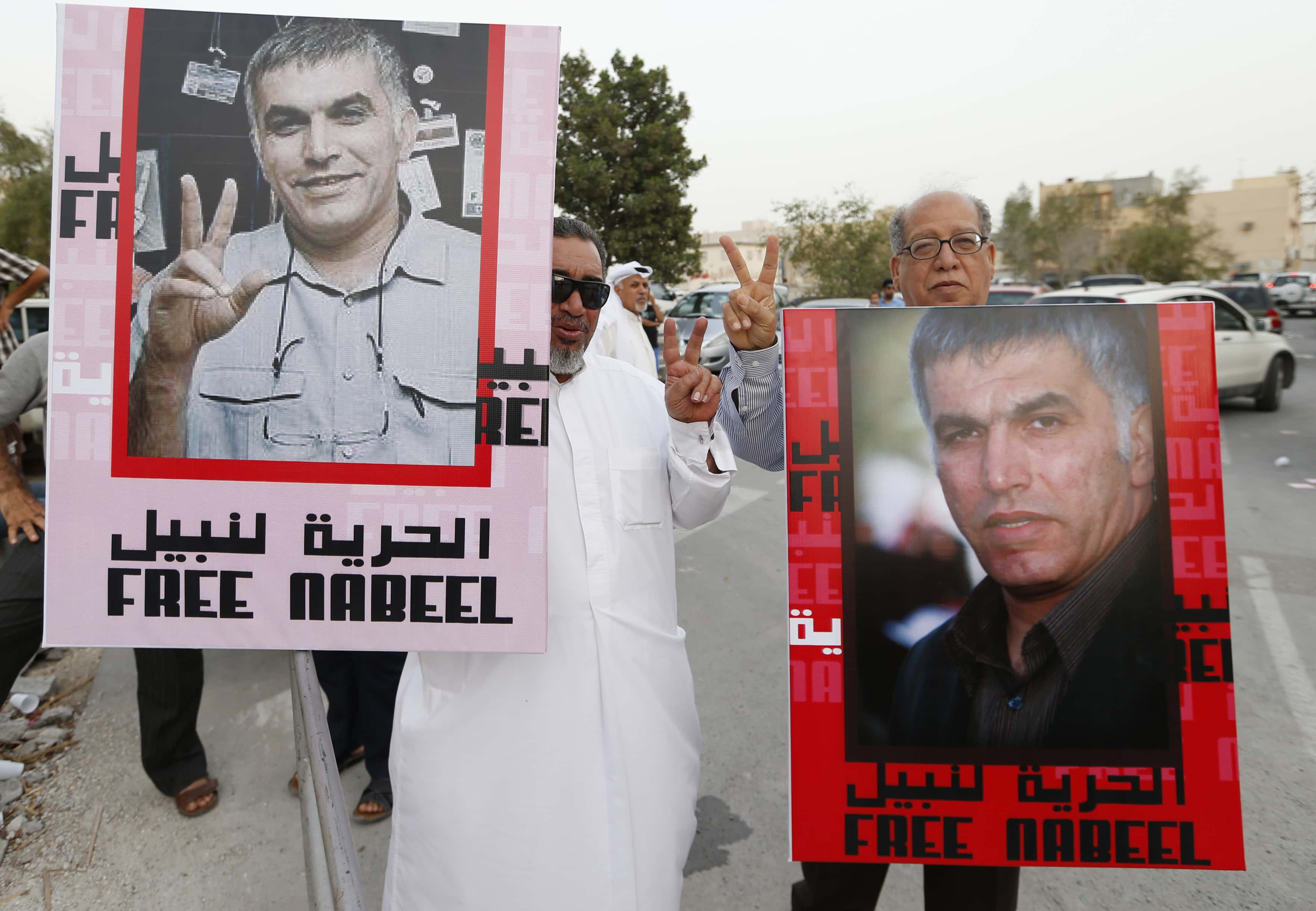 Protesters hold banners of human rights activist Nabeel Rajab during an anti-government sit-in organized by Bahrain's main opposition party Al Wefaq on 3 May 2013, REUTERS/Hamad I Mohammed