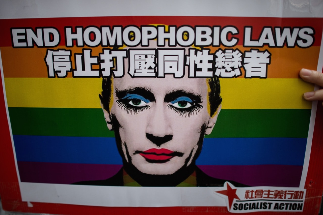 An activist holds a placard depicting President Vladimir Putin during a demonstration against Russia's anti-gay legislation in Hong Kong, 7 February 2014, PHILIPPE LOPEZ/AFP/Getty Images