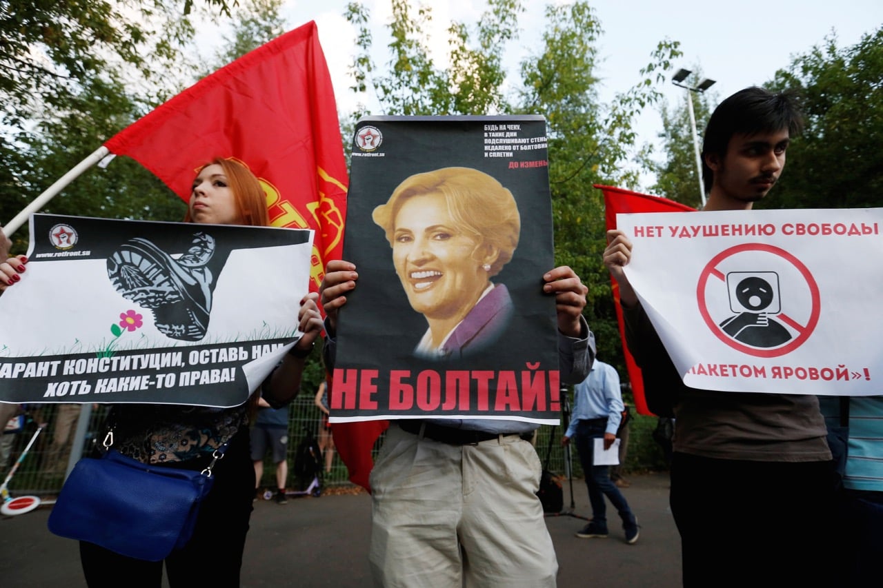 People protest against anti-terrorism legislation in Moscow's Sokolniki park, Russia, 9 August 2016. The signs read: "Do not talk!" (C), "Guarantor of constitution, leave us at least some of the rights" (L) and "No to choking of freedom with the package of laws by (Russian lawmaker Irina) Yarovaya" (R), REUTERS/Maxim Zmeyev