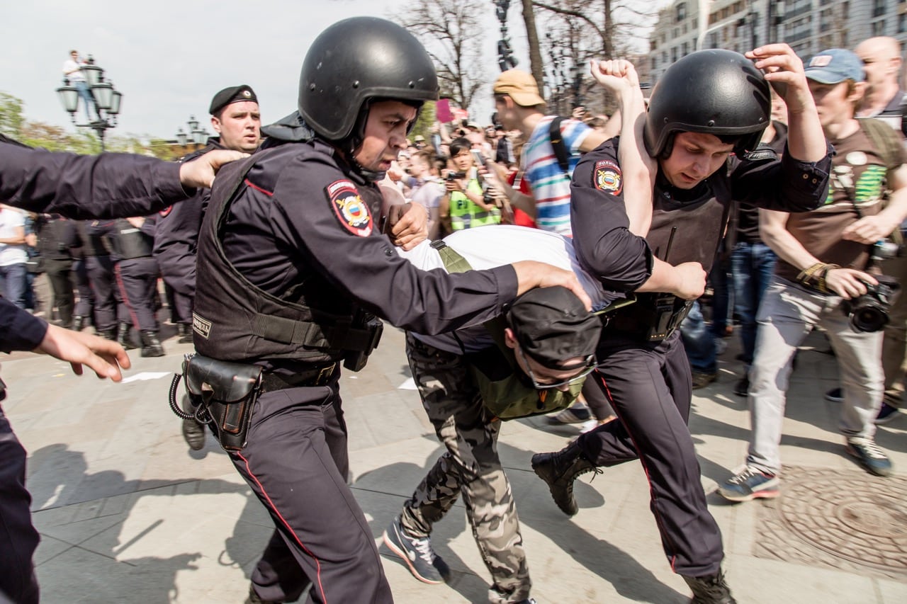 Russian police forces arrest a protester during an opposition demonstration at Pushkin Square in Moscow, 5 May 2018, Victor Kruchinin/SOPA Images/LightRocket via Getty Images