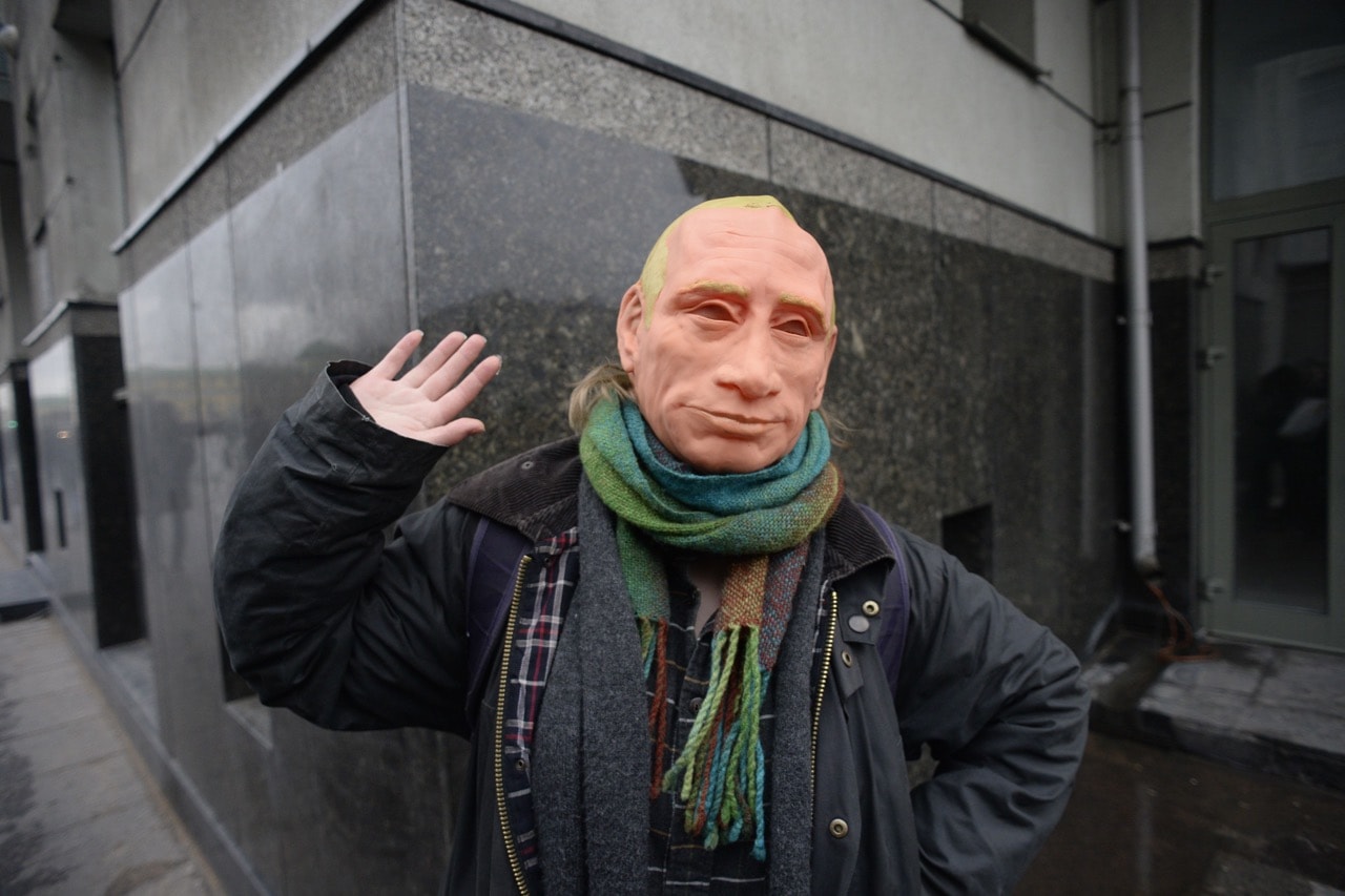 A supporter of opposition leader Alexei Navalny wearing a rubber mask depicting President Vladimir Putin takes part in a rally calling for a boycott of the March presidential elections, in Saint Petersburg, Russia, 28 January 2018 , OLGA MALTSEVA/AFP/Getty Images