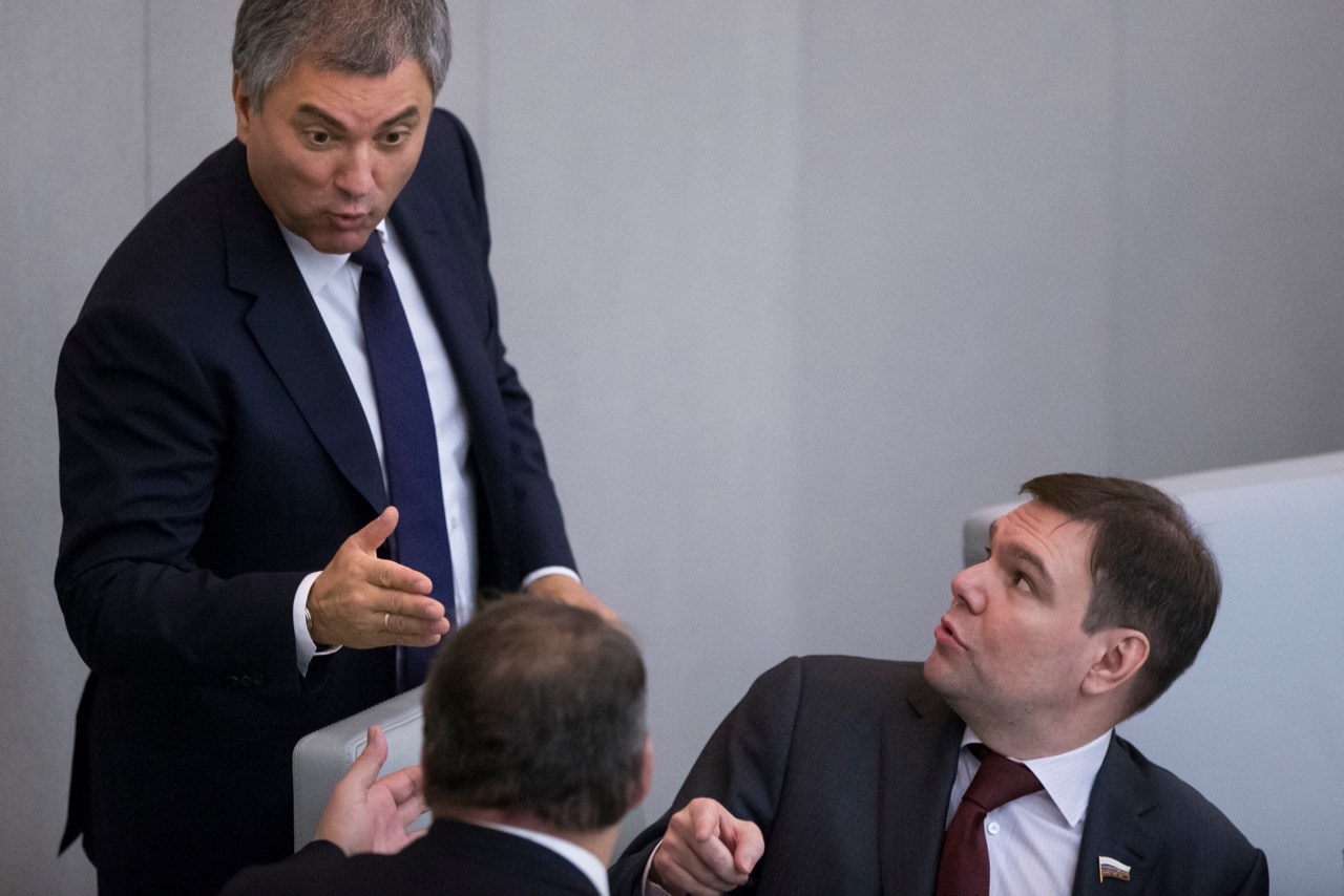 Speaker of the State Duma, Vyacheslav Volodin, top, gestures while speaking to lawmaker Leonid Levin, right, and Deputy Speaker Pyotr Tolstoy, with his back to the camera, during the session when the "foreign agent law" was passed in Moscow, Russia, 15 November 2017, AP Photo/Alexander Zemlianichenko