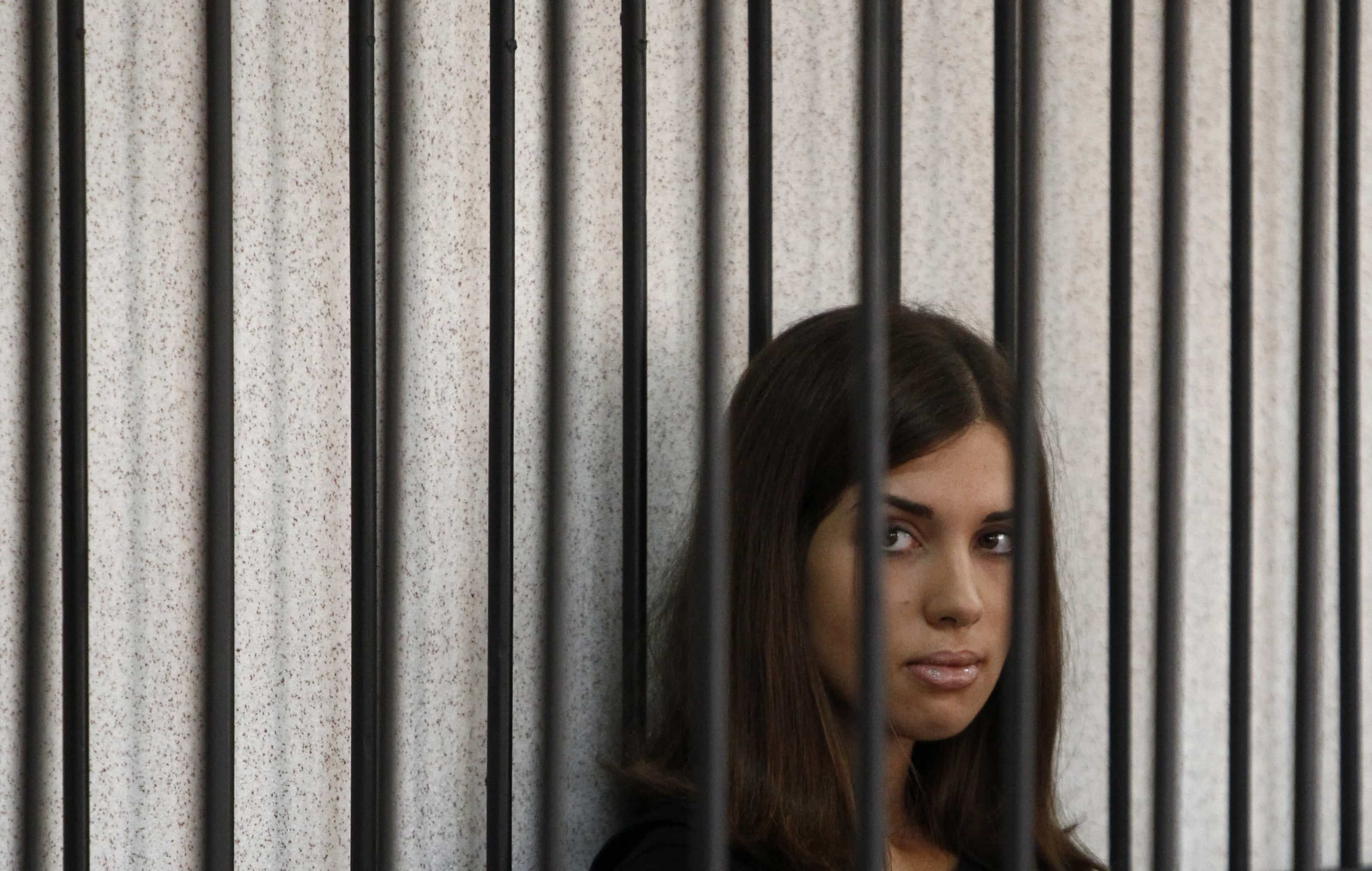 Nadezhda Tolokonnikova looks out from a holding cell as she attends a court hearing to appeal for parole at the Supreme Court of Mordovia in Saransk, 26 July 2013., REUTERS/Sergei Karpukhin