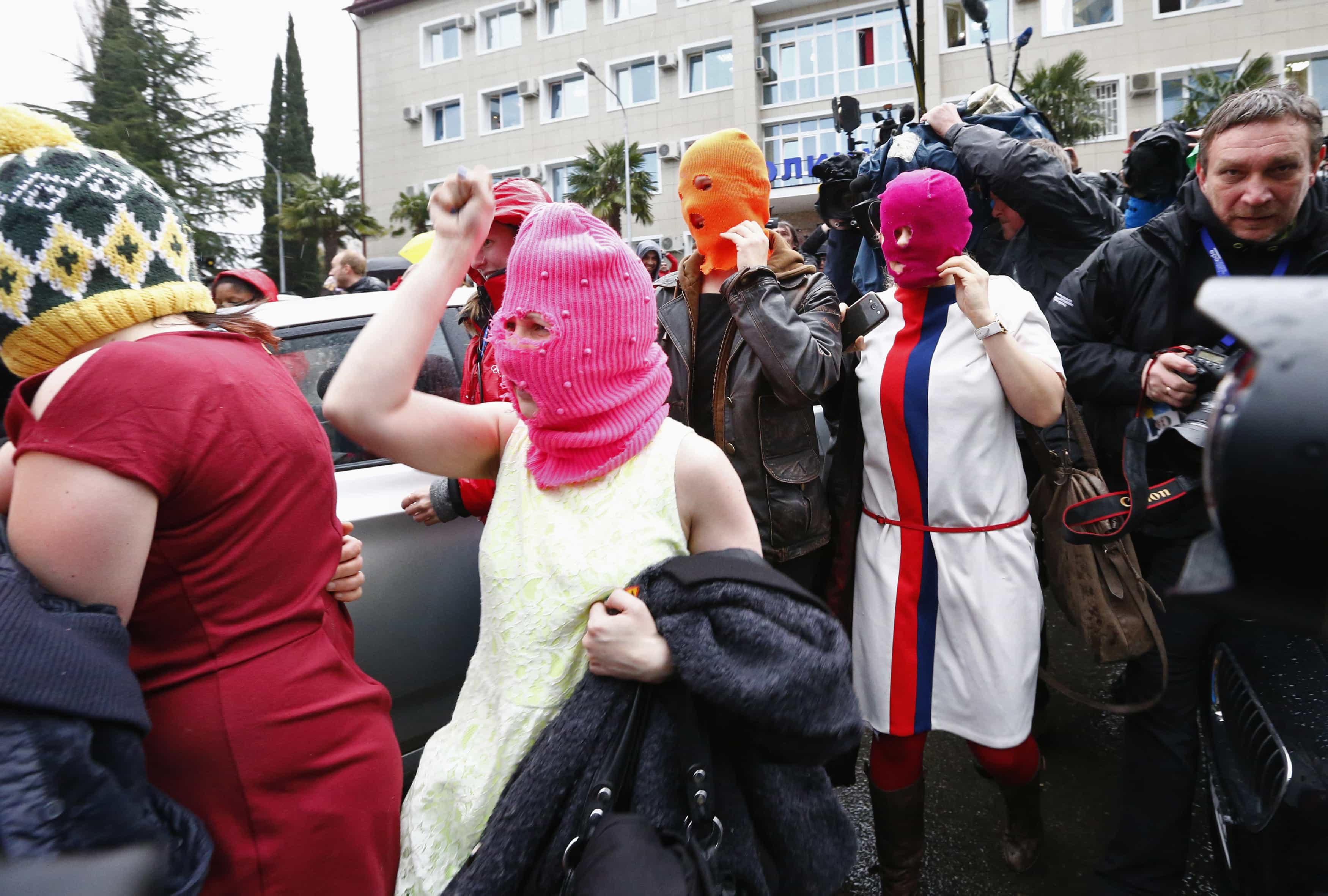 Masked members of Pussy Riot leave a police station in Adler during the 2014 Sochi Winter Olympics, 18 February 2014., REUTERS/Shamil Zhumatov