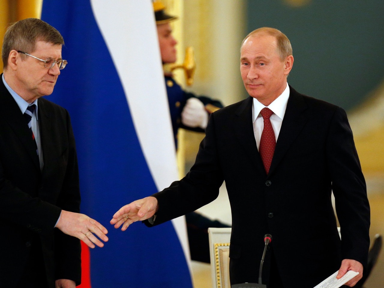 Russian President Vladimir Putin, right, greets Prosecutor General Yury Chaika, left, as he enters a hall to attend a meeting with regional officials in the Kremlin in Moscow, 31 January 2013, AP Photo/Alexander Zemlianichenko, Pool