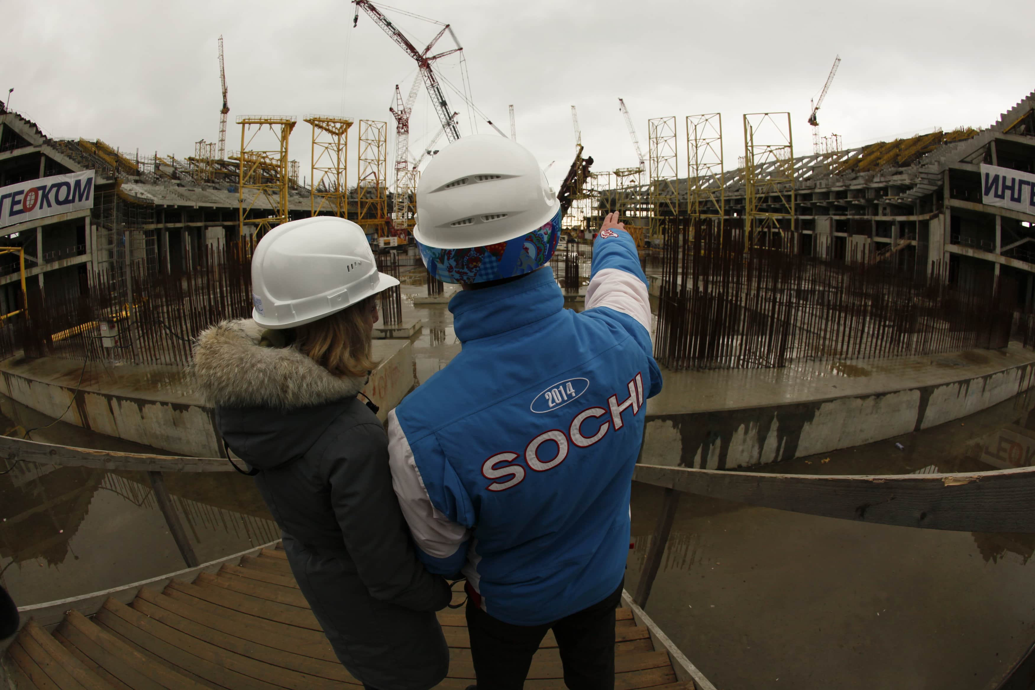 A volunteer shows a journalist the facilities of the Olympic stadium "Fisht" during an organized tour of the construction sites for the Olympic venues in Sochi, 10 February 2012., REUTERS/Wolfgang Rattay