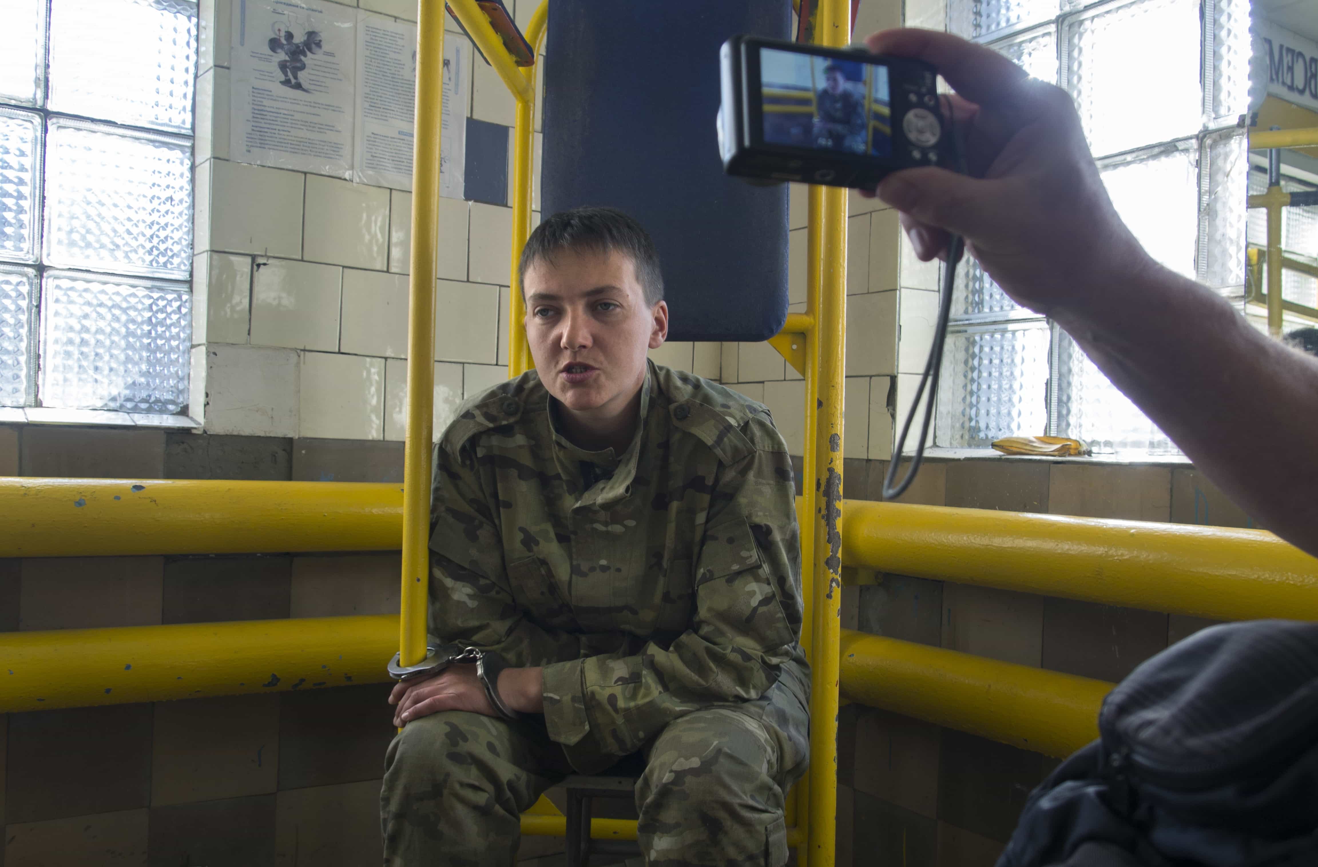 Ukrainian army officer Nadezhda Savchenko speaks to journalists in Ukraine, 19 June 2014. Journalist Yevgeny Agarkov is reported to have travelled to Voronezh to cover Savchenko's case., AP Photo/Igor Golovniov