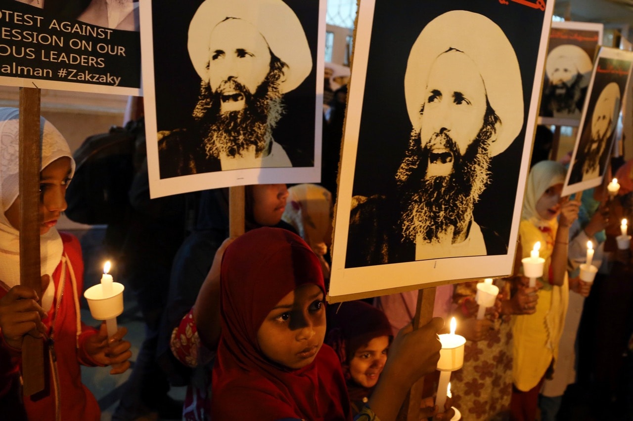 Indian Shiite Muslim children carry portraits of Shiite cleric Sheikh Nimr al-Nimr during a protest against Saudi Arabia in Bangalore, India, 8 January 2016, AP Photo/Aijaz Rahi