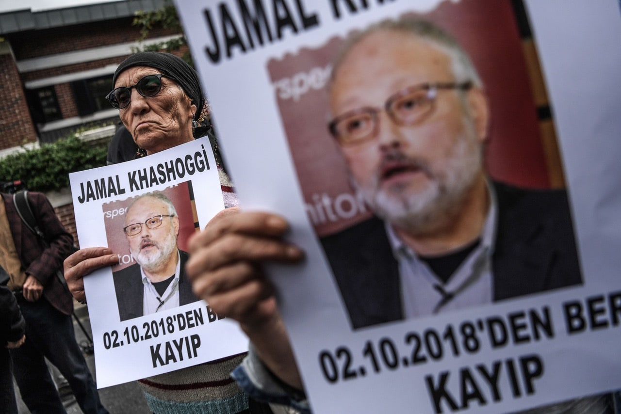 Protesters hold a portrait of missing journalist and Riyadh critic Jamal Khashoggi reading 'Jamal Khashoggi is missing since October 2' during a demonstration in front of the Saudi Arabian consulate in Istanbul, Turkey, 9 October 2018, OZAN KOSE/AFP/Getty Images