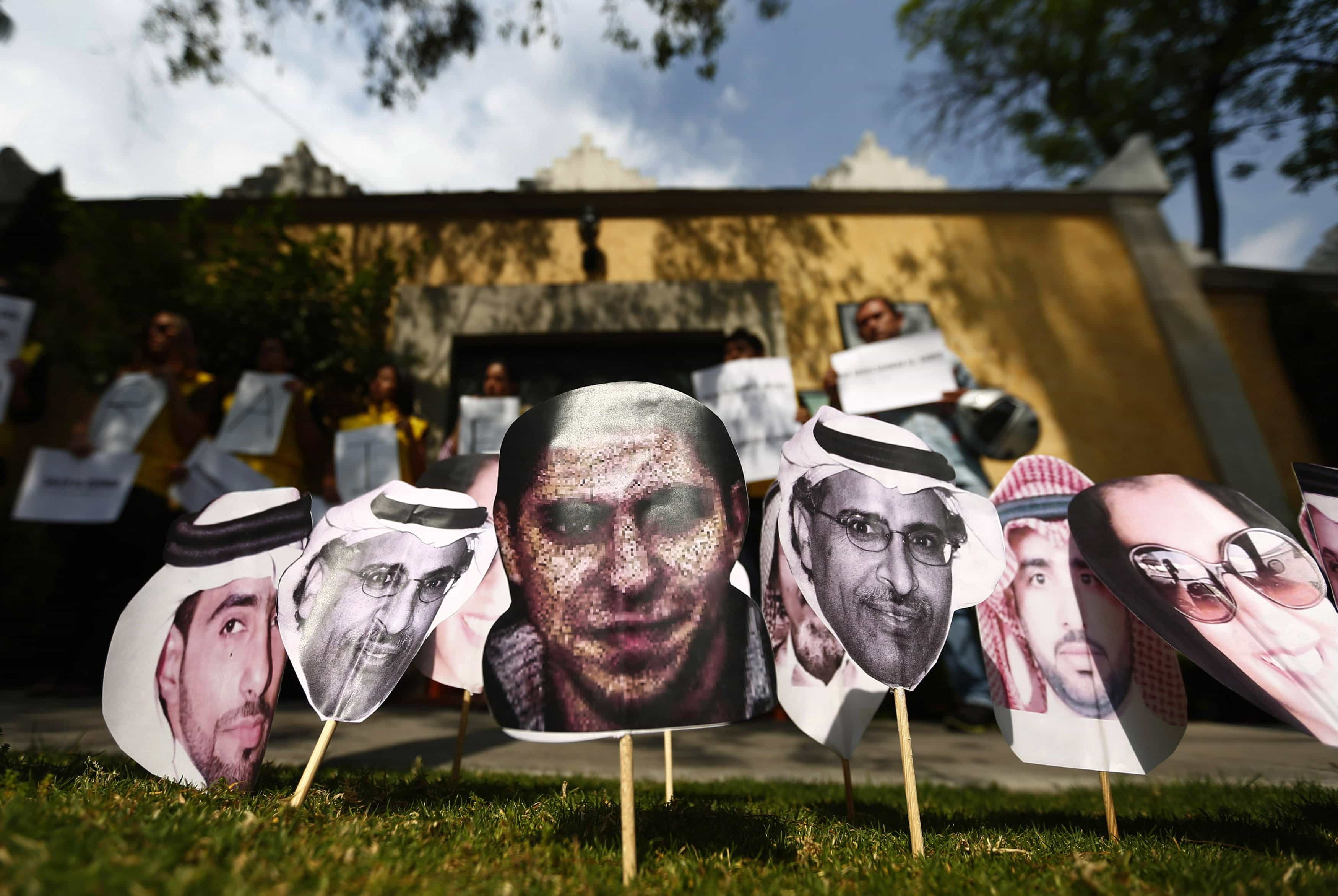 A picture of Saudi blogger Raif Badawi (C) is seen between other photos of prisoners in Saudi Arabia during a demonstration for his release from jail outside the Embassy of Saudi Arabia in Mexico City, 20 February 2015, REUTERS/Edgard Garrido