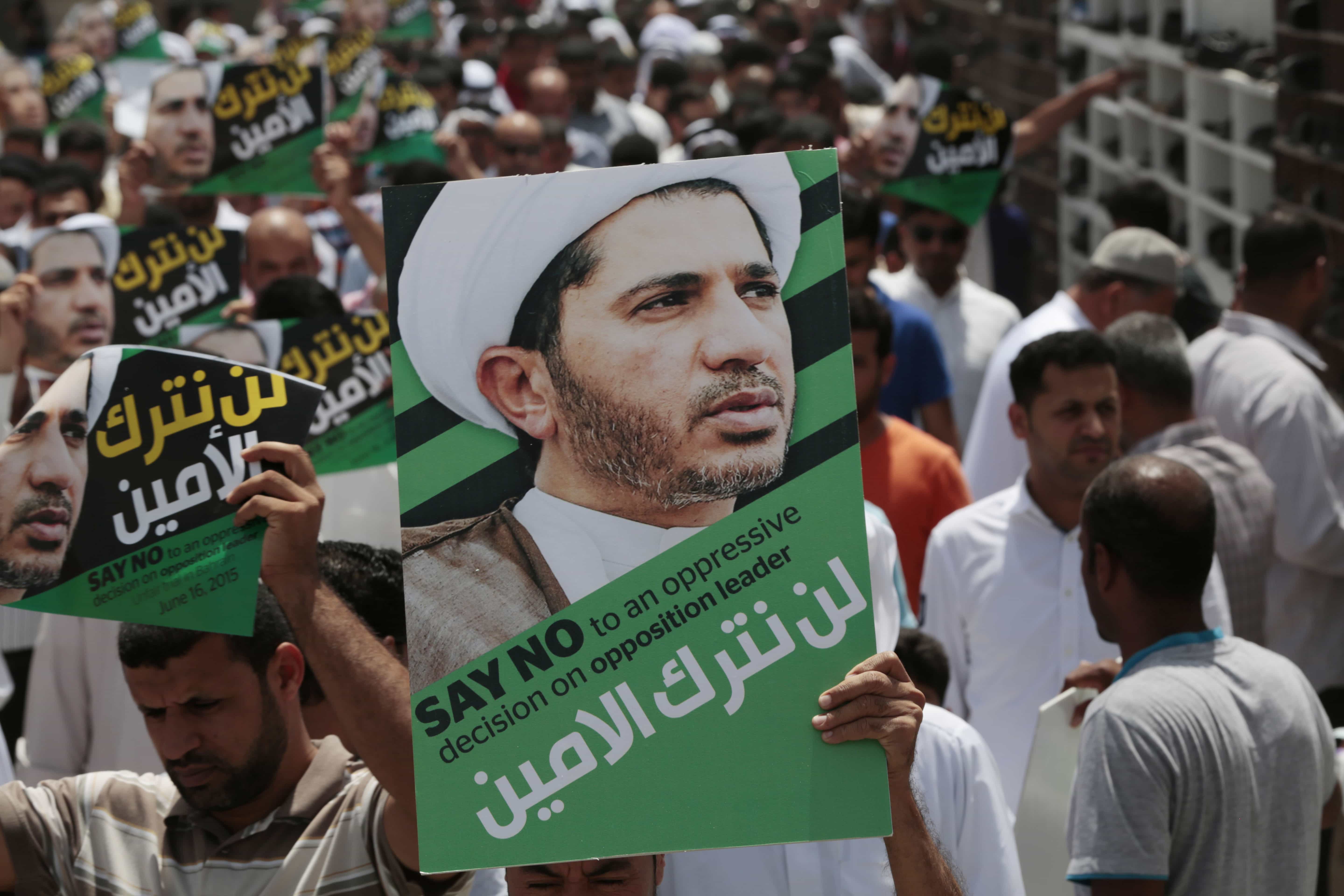 Bahrainis march in support of prominent jailed opposition leader Sheikh Ali Salman on 12 June. Arabic on the posters reads: "We will not abandon the secretary-general." , AP Photo/Hasan Jamali