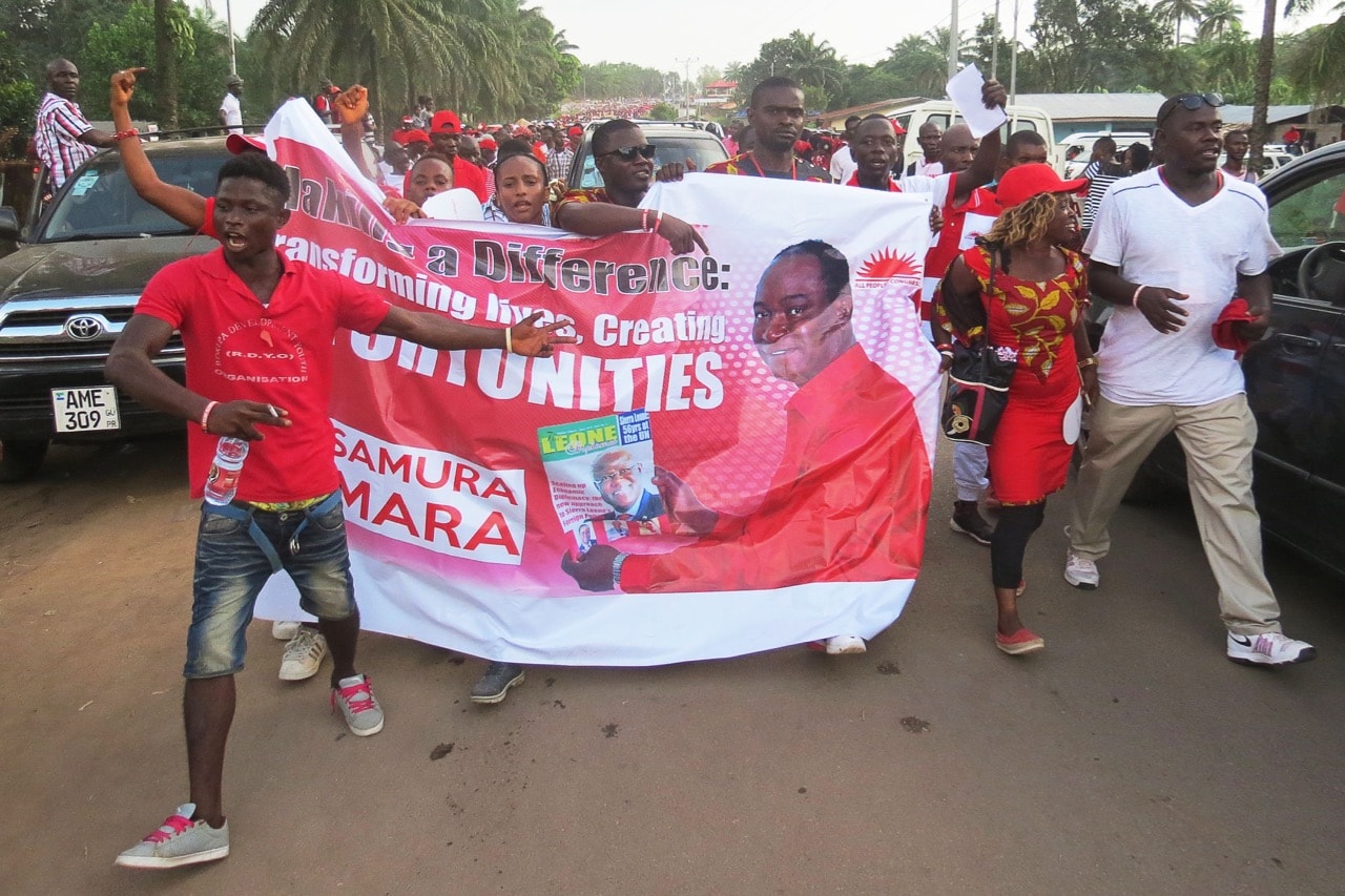 Supporters of Samura Kamara celebrate in the streets of Makeni, northern Sierra Leone, on 16 October 2017, after he was selected as a candidate for the ruling All People Congress (APC) for the 2018 presidential elections, SAIDU BAH/AFP/Getty Images