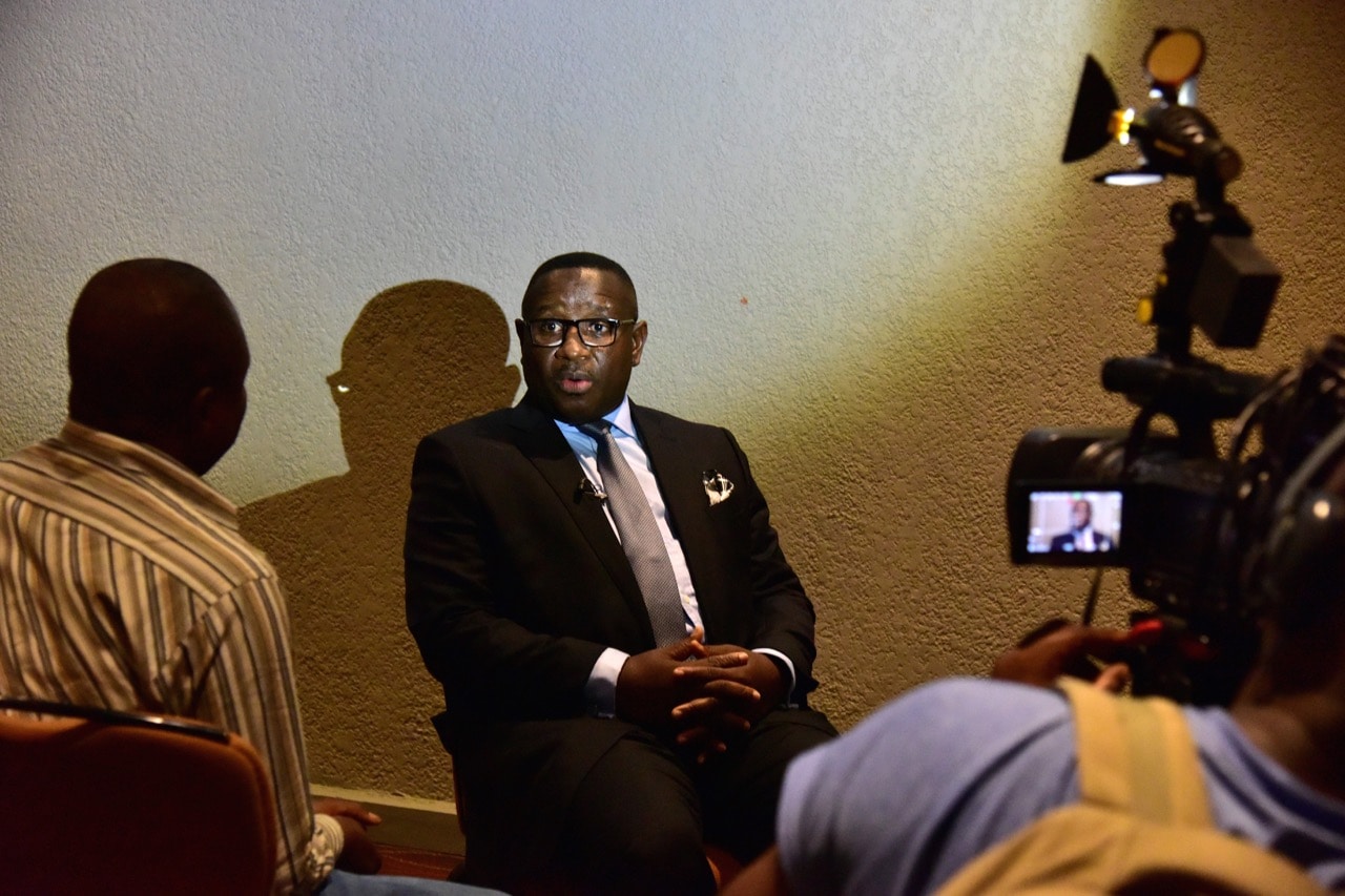 Sierra Leone Peoples Party (SLPP) presidential candidate, former general Julius Mada Bio (C) answers journalists' questions in Freetown, 25 March 2018, ISSOUF SANOGO/AFP/Getty Images