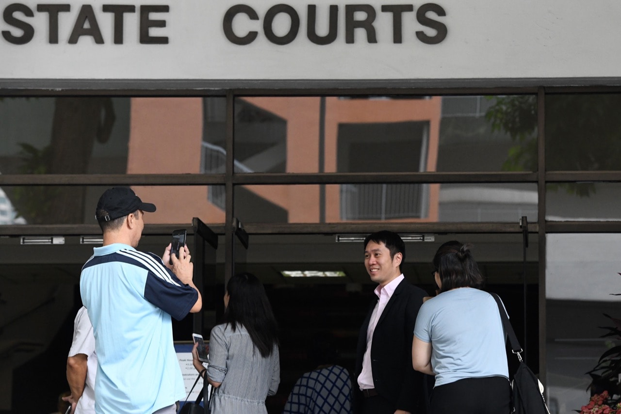 Political activist Jolovan Wham (2nd R) arrives at the State court in Singapore, 3 January 2019, ROSLAN RAHMAN/AFP/Getty Images