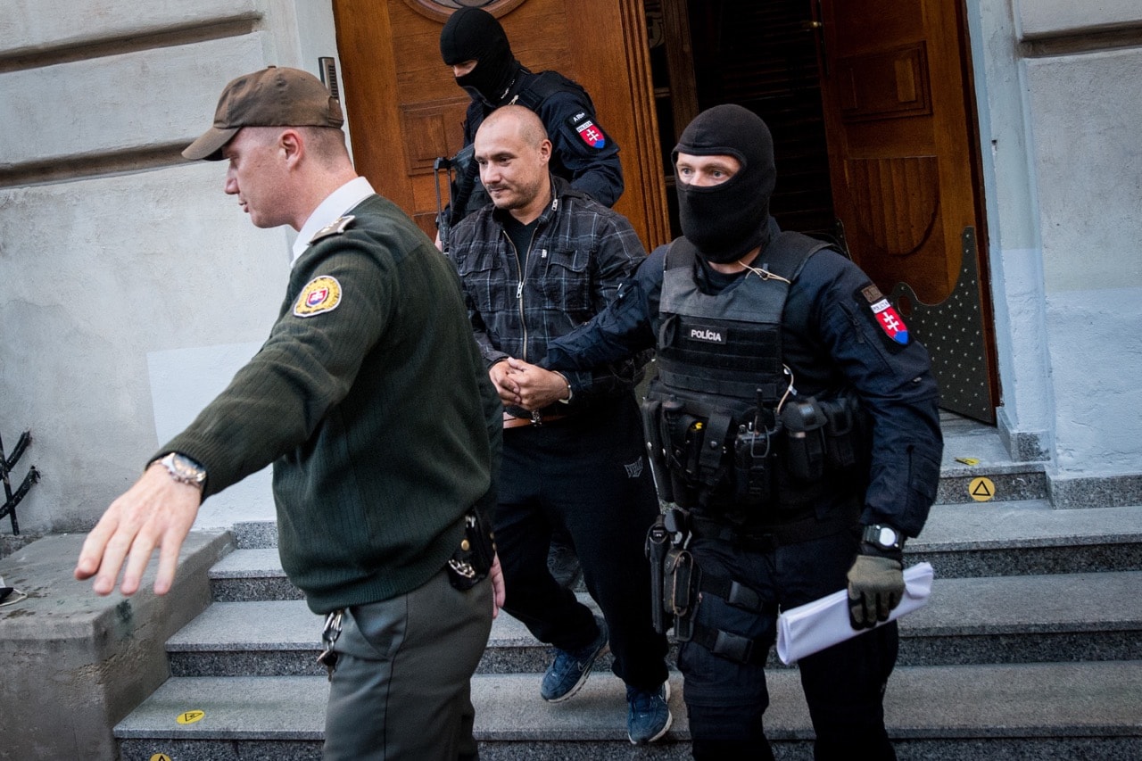 Police officers escort Tomas Sz, a suspect charged with the premeditated murder of Slovak investigative journalist Ján Kuciak, and his fiancée, Martina Kušnírová, in Banska Bystrica, 30 September 2018, VLADIMIR SIMICEK/AFP/Getty Images