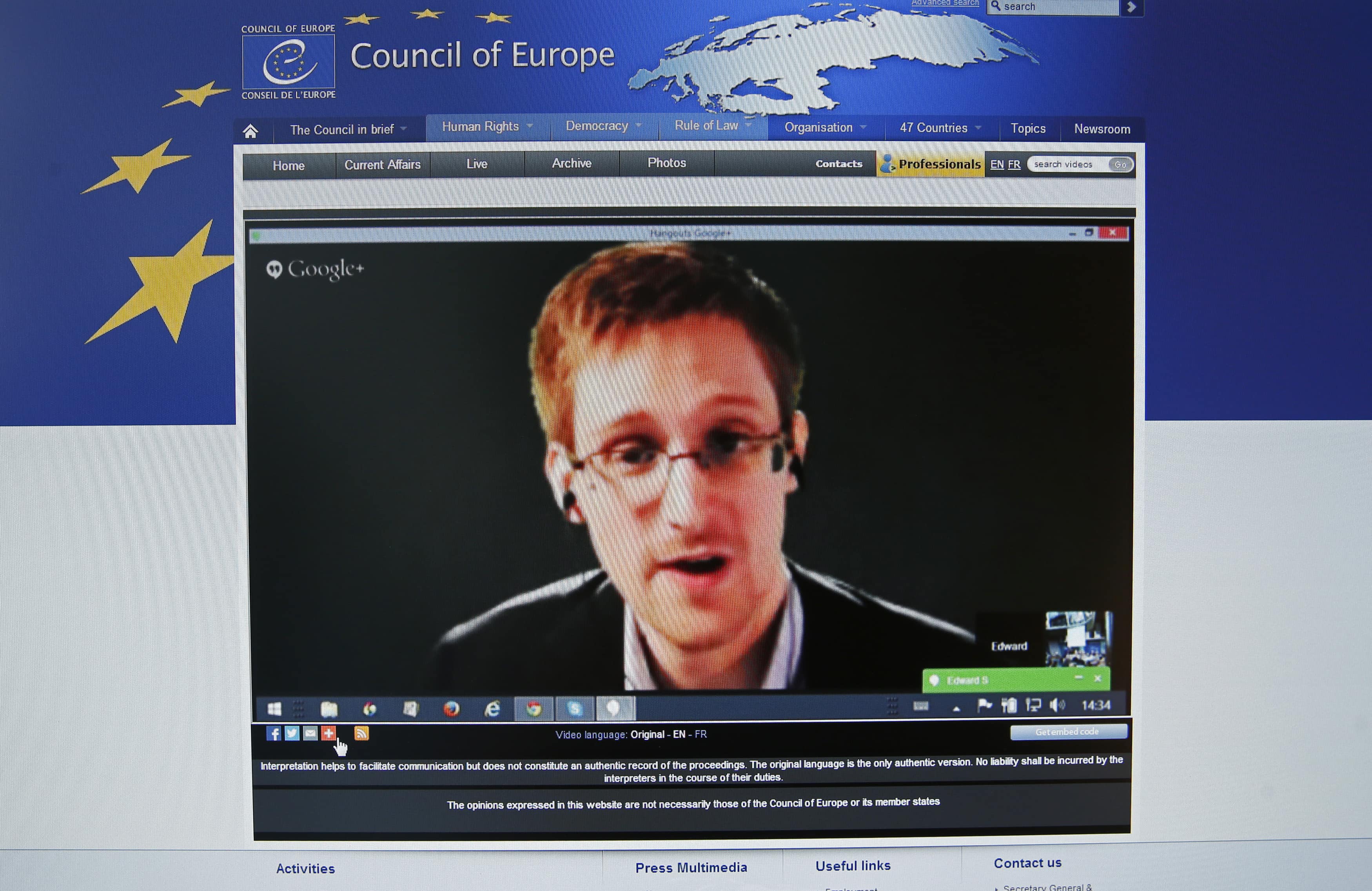 Edward Snowden is seen on the computer screen of a journalist during a hearing on "mass surveillance" in Strasbourg, 8 April 2014., REUTERS/Vincent Kessler