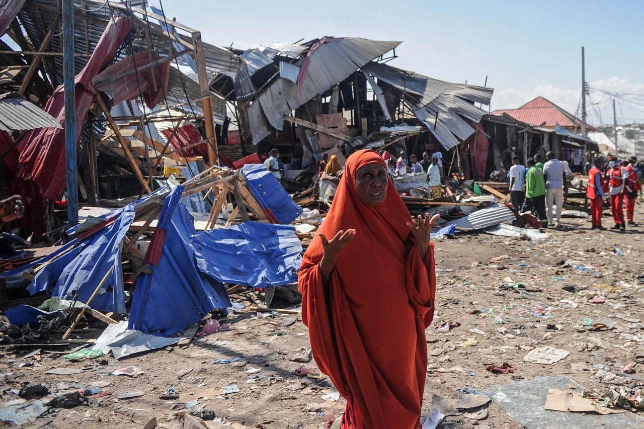 A Somali woman reacts after a car bomb detonates at a busy market in Mogadishu, 26 November 2018, MOHAMED ABDIWAHAB/AFP/Getty Images