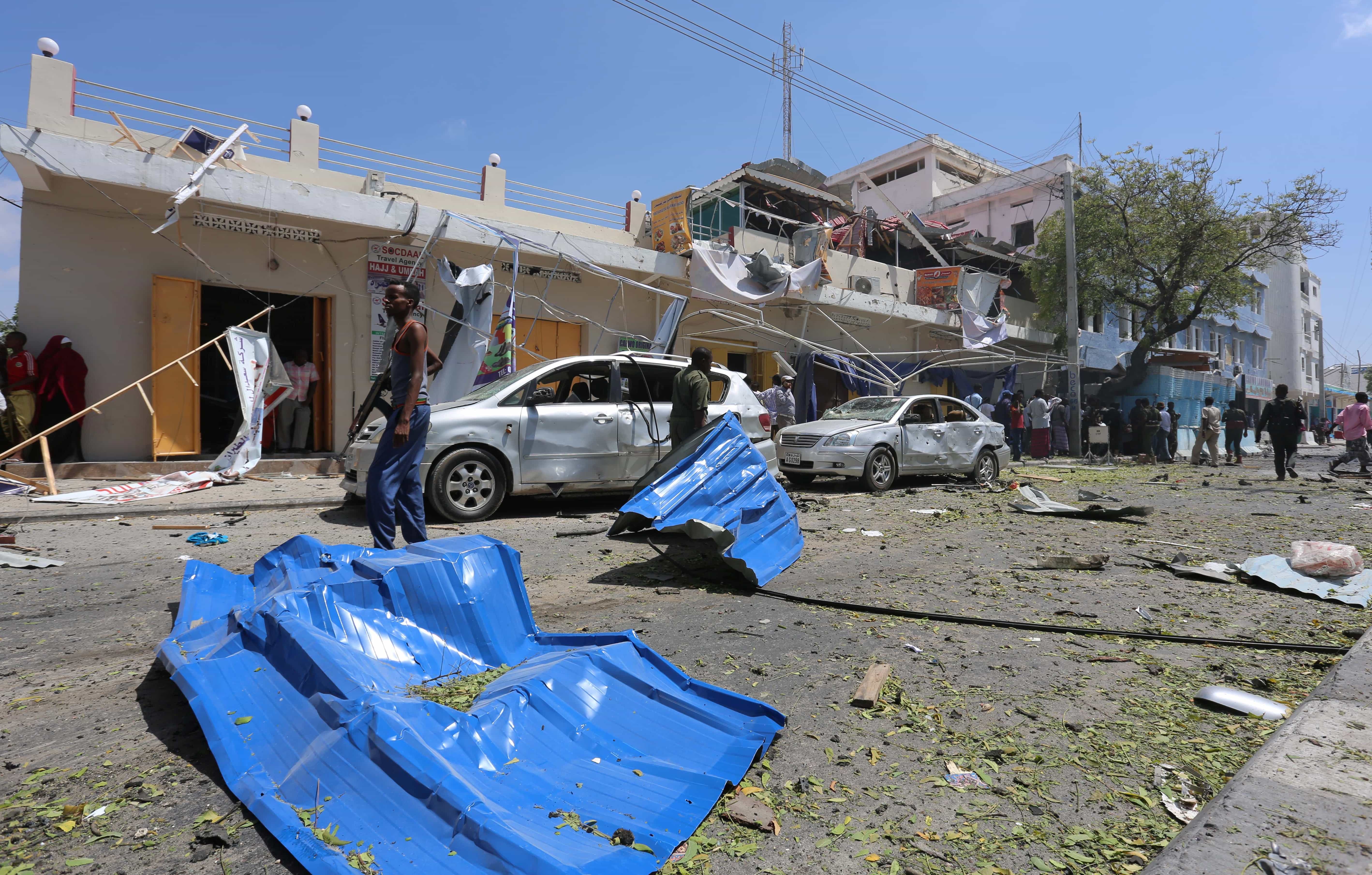 A general view shows security officials securing the scene of an explosion near Wehliye Hotel in Mogadishu, 13 March 2017, REUTERS/Feisal Omar