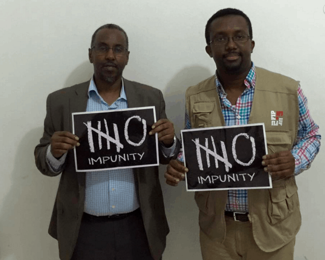 NUSOJ Secretary General Omar Faruk Osman (right) is pictured next to Somali Minister of Internal Security Abdirisak Omar Mohamed., NUSOJ