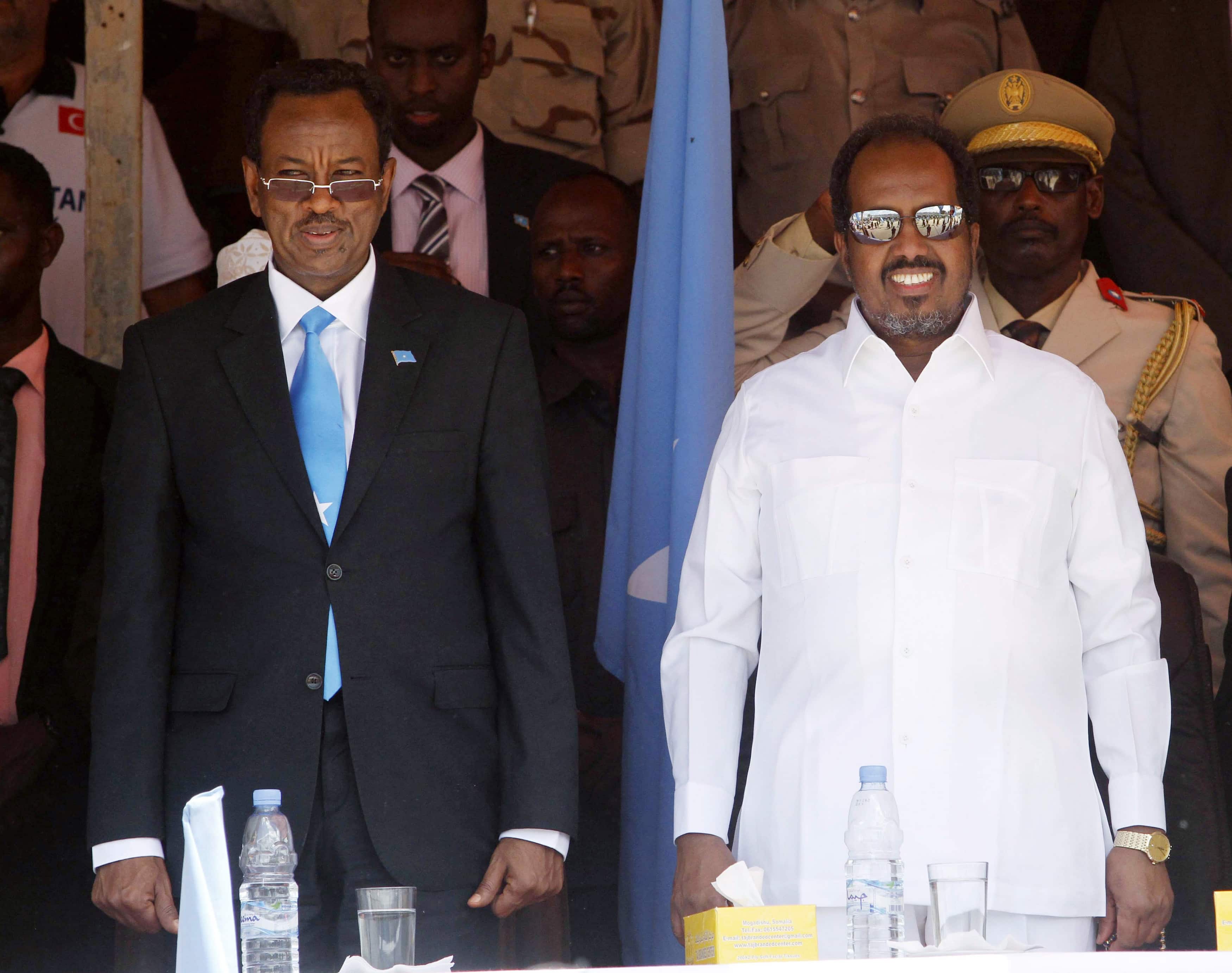 Somalia's Prime Minister Abdi Farah Shirdon Saaid (L) and President Hassan Sheikh Mohamud (R) at an event in Mogadishu July 2013., REUTERS/Feisal Omar