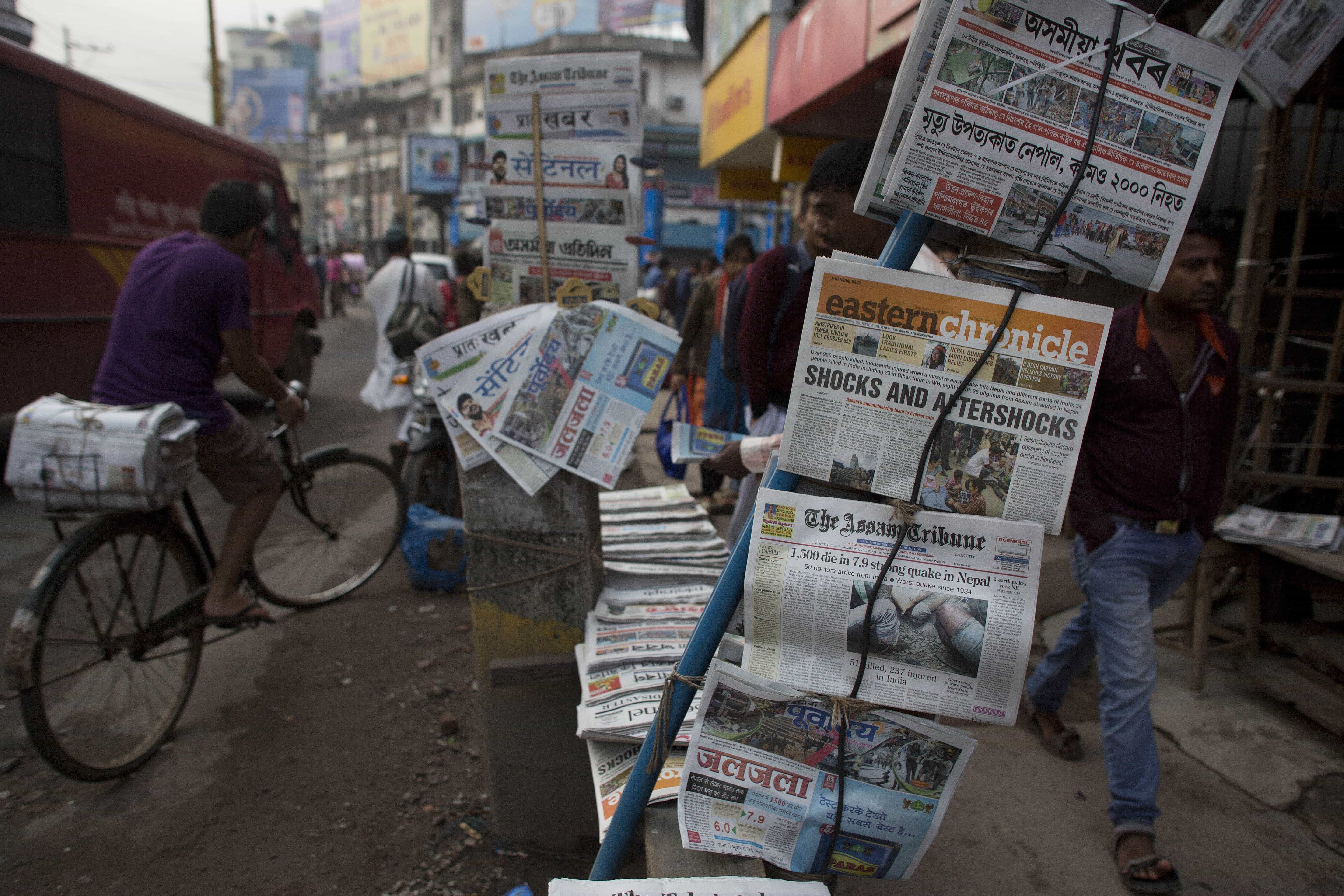 Newspapers displayed for sale on a pavement in Gauhati, India, 26 April 2015, AP Photo/Anupam Nath