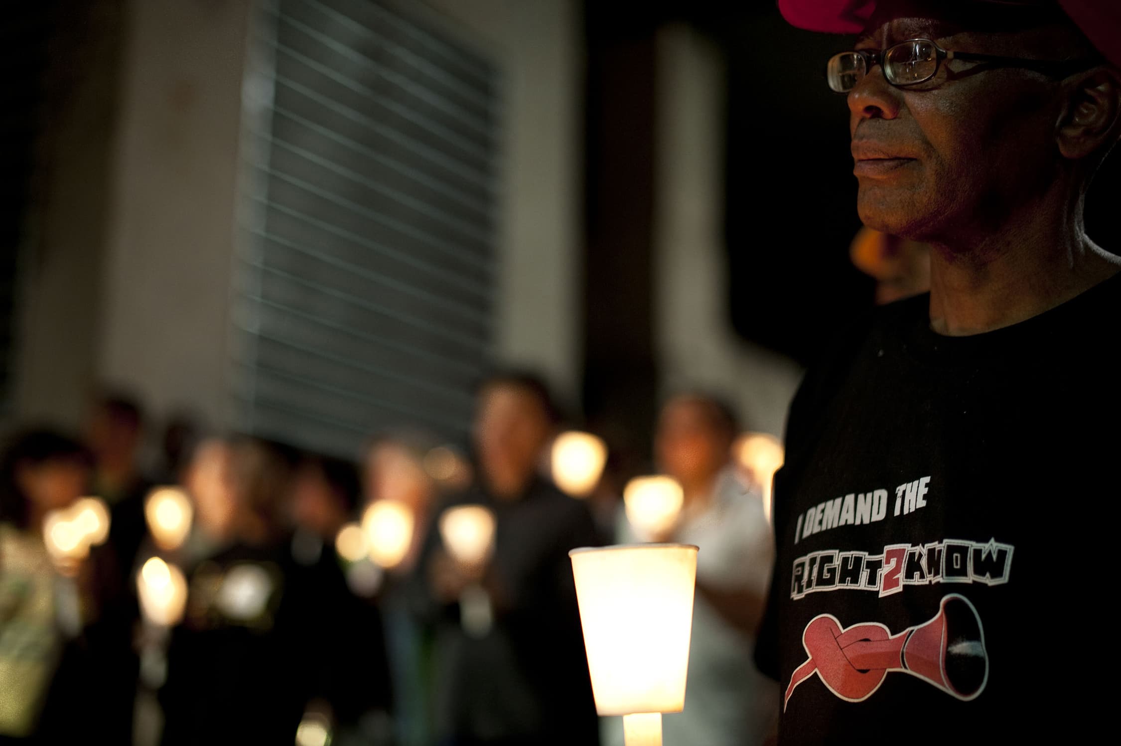 Activists and supporters of the Right 2 Know campaign hold a night vigil outside the Constitutional Court in Johannesburg 19 September, 2011, REUTERS/Shayne Robinson