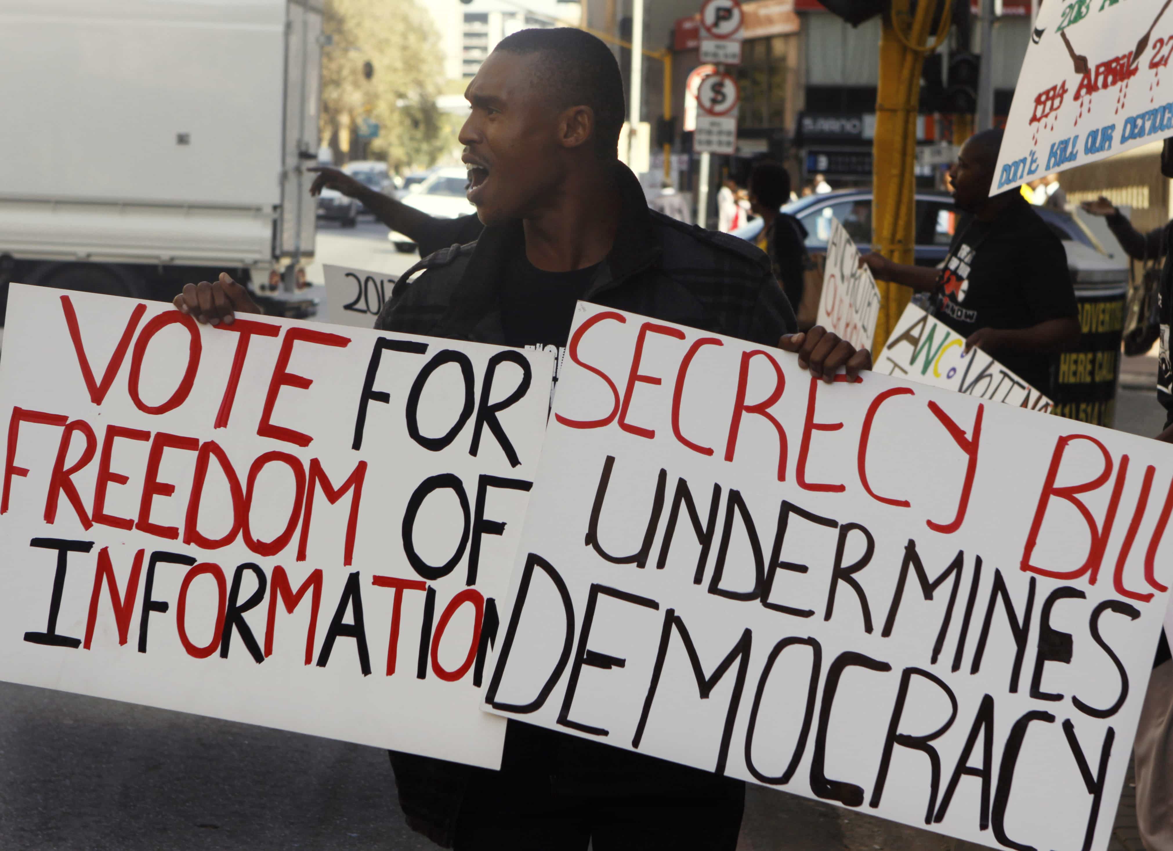 A demonstrator protests outside the ruling African National Congress headquarters in Johannesburg, 25 April 2013, against the Protection of State Information Bill., AP Photo/Denis Farrell