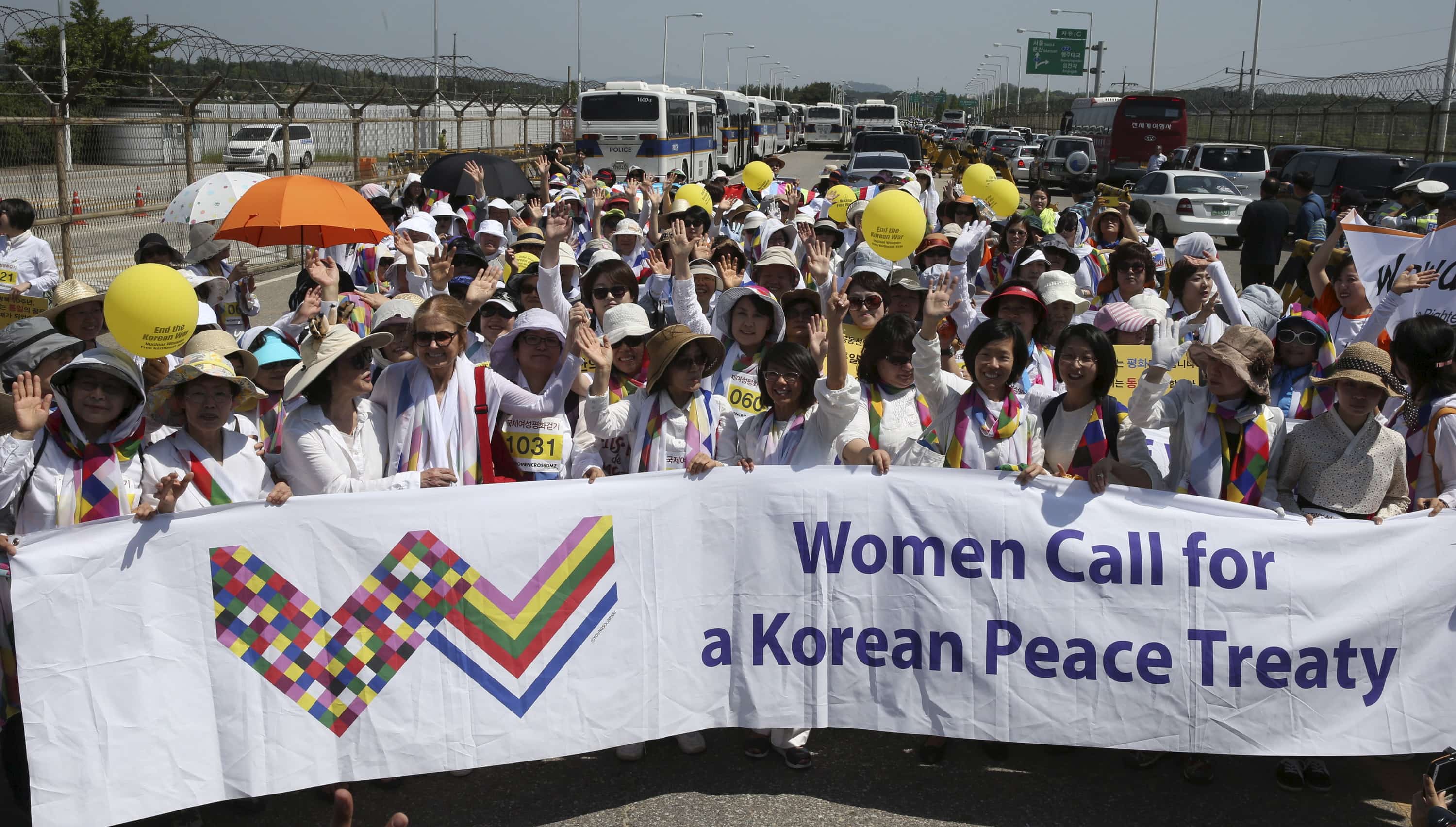 South Korean peace activists and other groups near a military check point in Paju, 24 May 2015, after crossing the Demilitarised Zone separating North and South Korea, REUTERS/Seo Myung-Gon/Yonhap