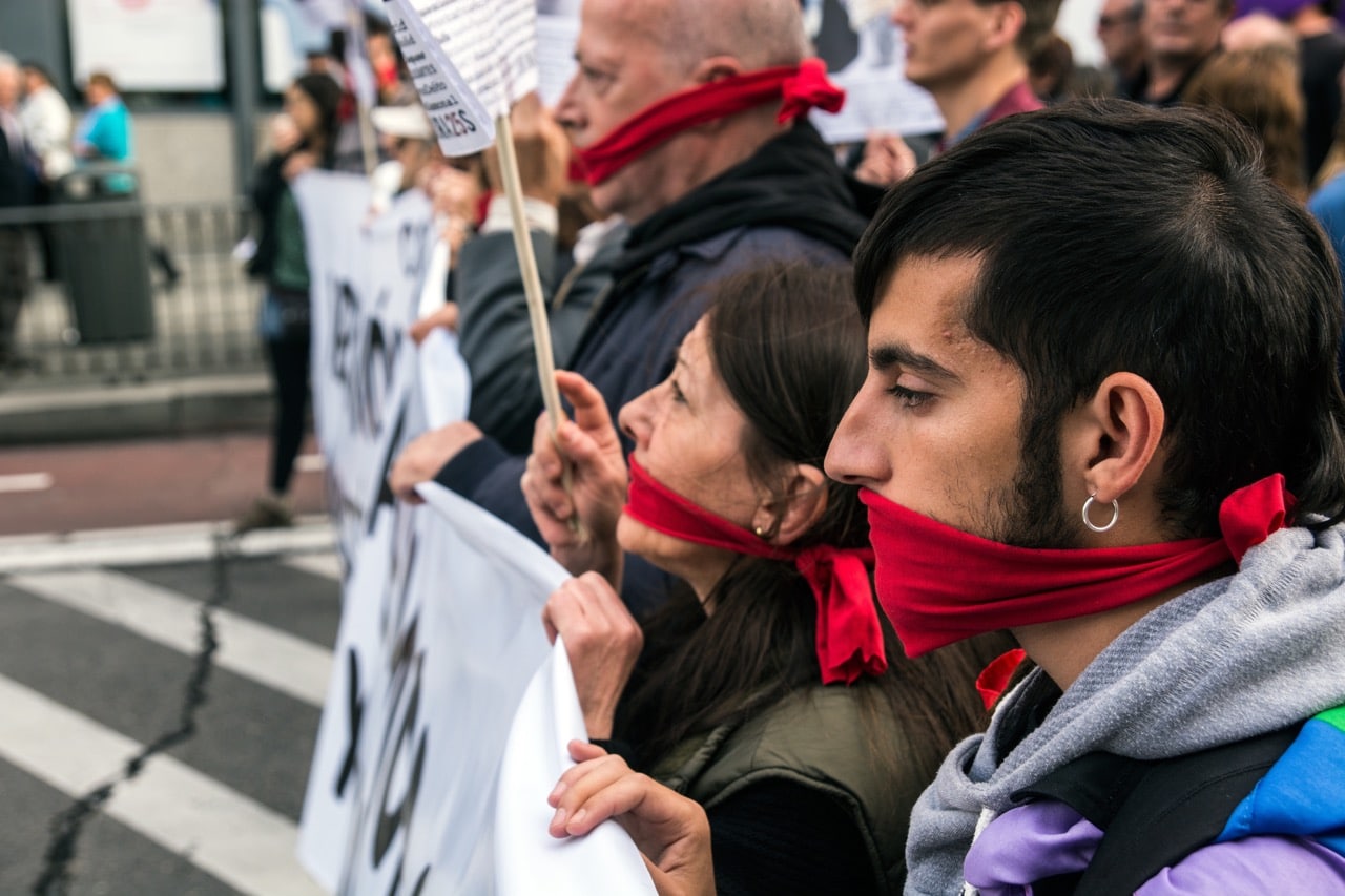 Gagged individuals protest against the Spanish Citizen Security Law, or "Gag Law", demanding its abolition, in Madrid, 7 May 2016, Marcos del Mazo/Pacific Press/LightRocket via Getty Images