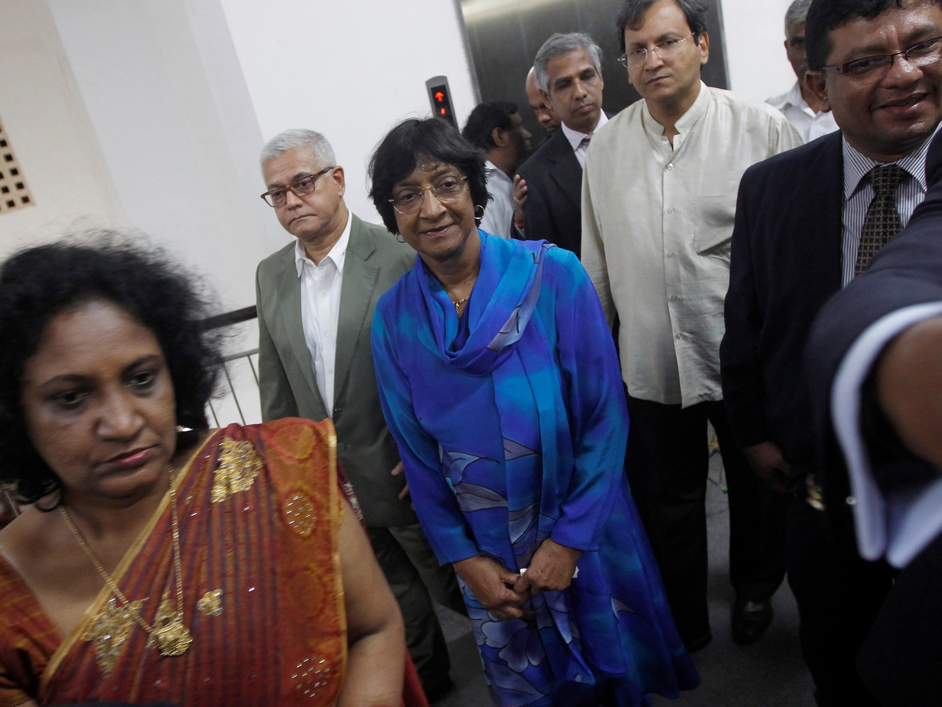 UN High Commissioner for Human Rights Navi Pillay (in blue) arrives at Jaffna general hospital, 26 August 2013, REUTERS/Dinuka Liyanawatte