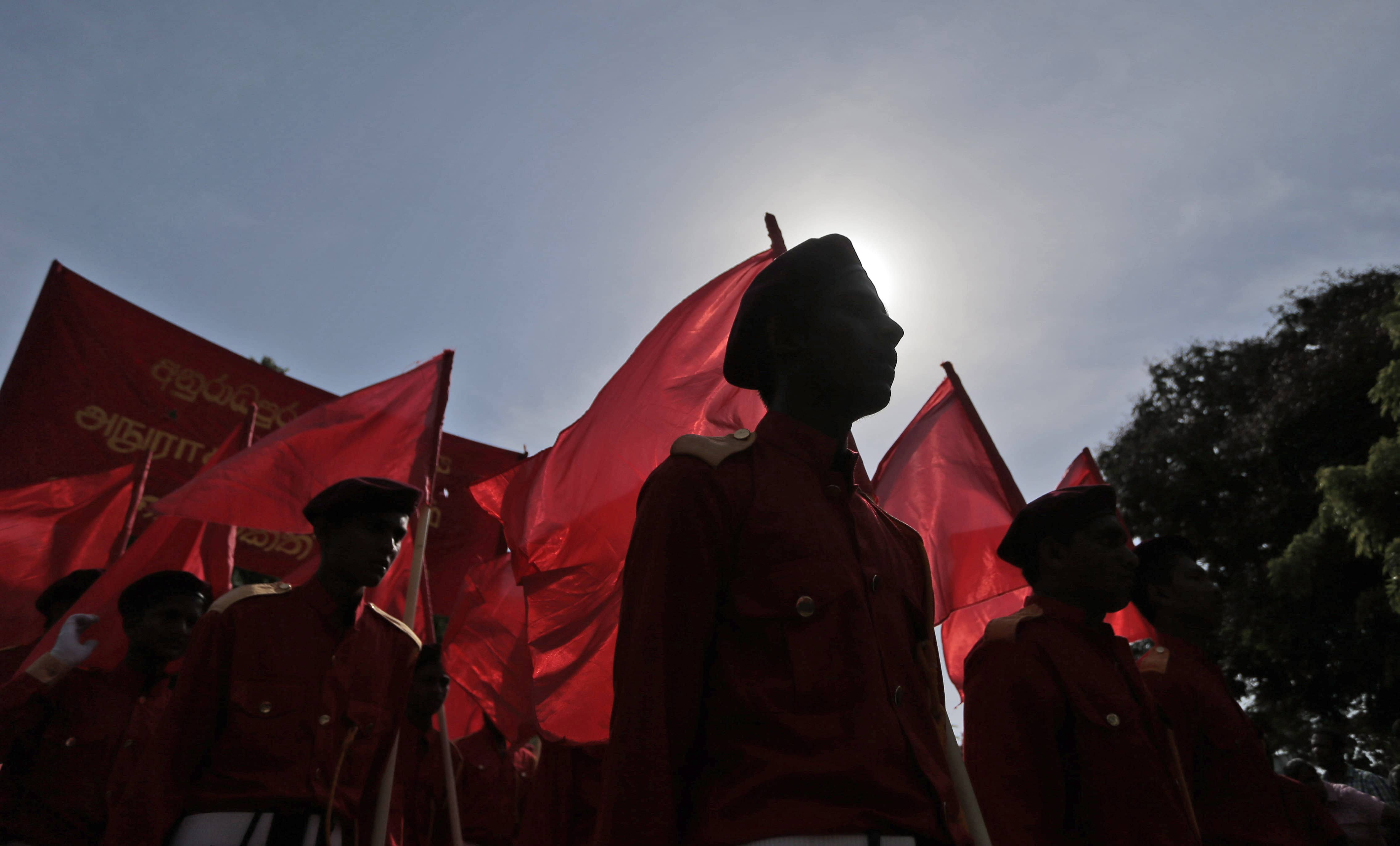 Activists of the Sri Lankan Marxist political party Peoples' Liberation Front march during a rally to mark International Labor Day in Colombo, Sri Lanka, 1 May 2015, AP Photo/Eranga Jayawardena
