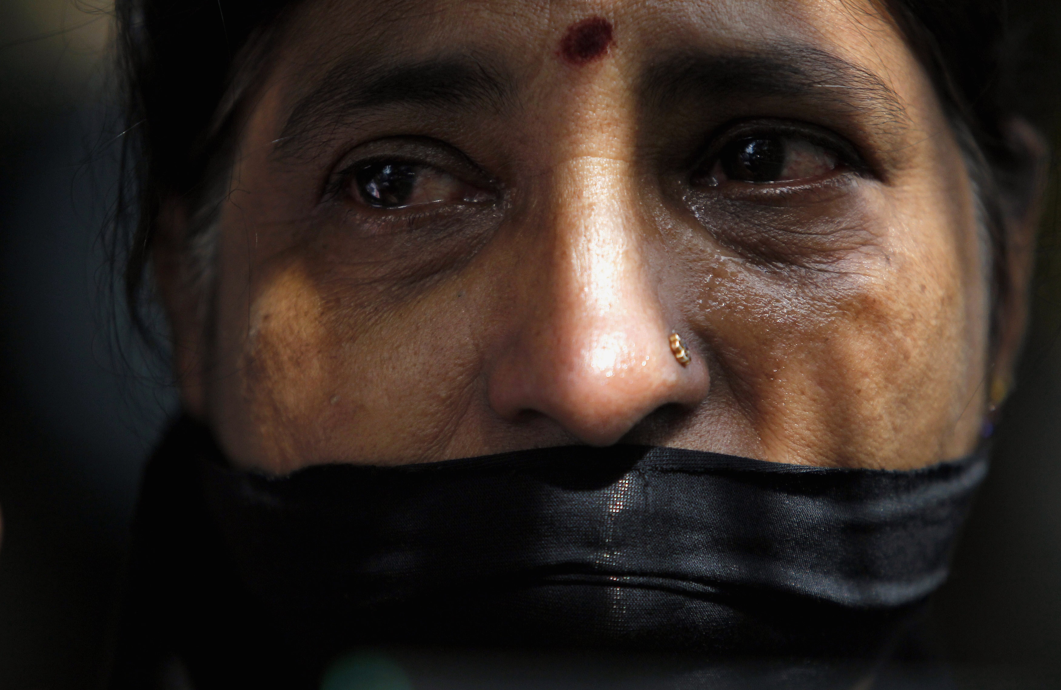 A Tamil woman takes part in a 24 January 2013 protest in Colombo to mark 3 years since the disappearance of journalist Prageeth Eknaligoda, REUTERS/Dinuka Liyanawatte