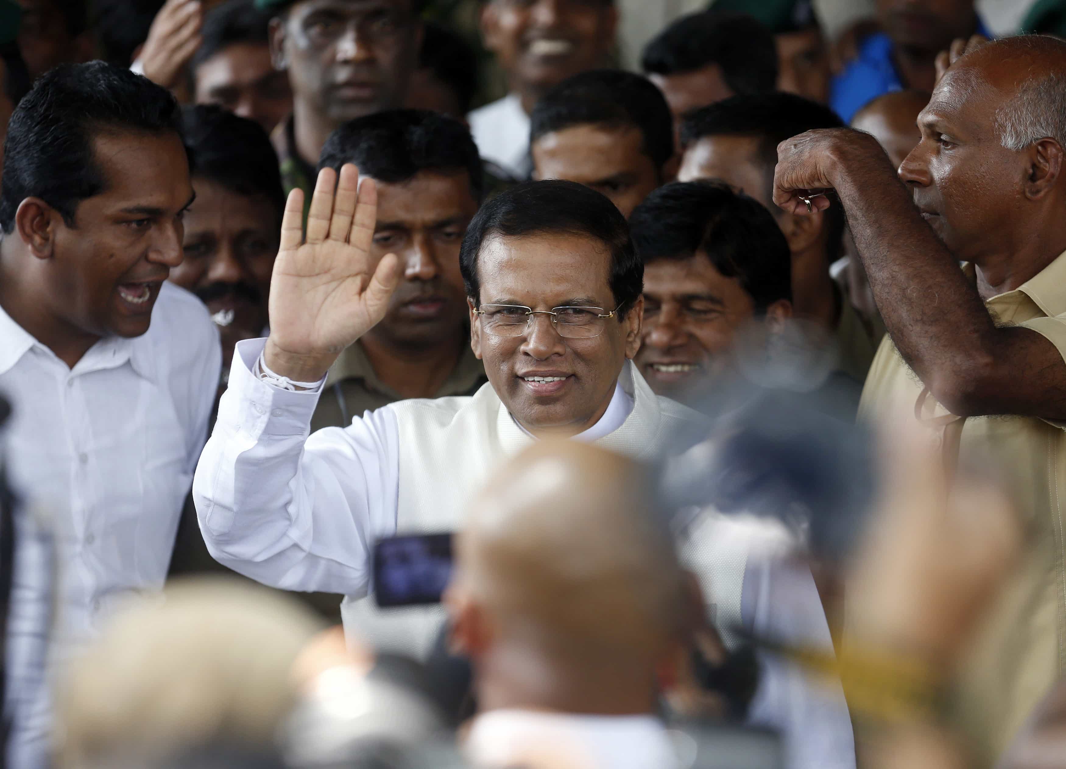 Sri Lanka's newly elected president Mithripala Sirisena waves at media as he leaves the election commission in Colombo, 9 January 2015, REUTERS/Dinuka Liyanawatte