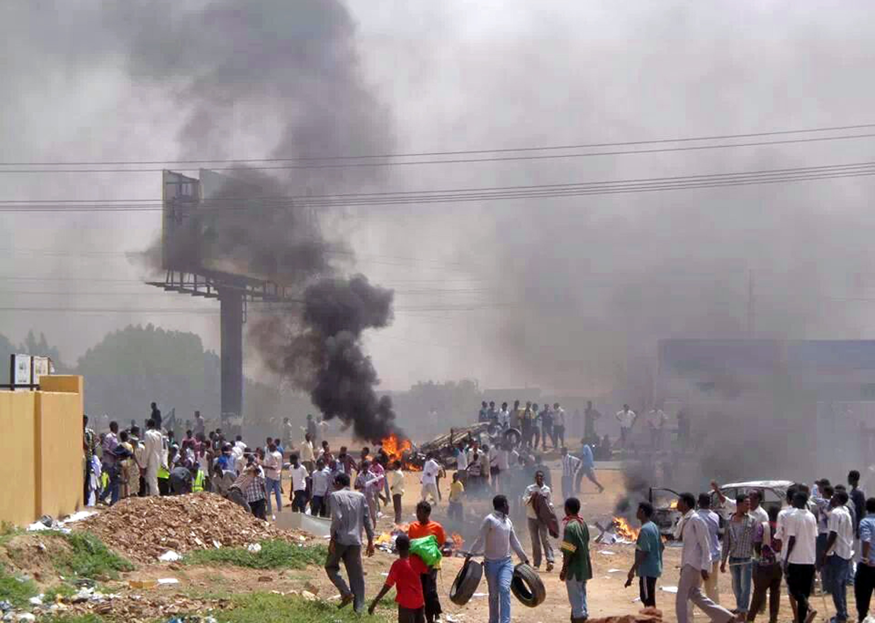 People take part in protests over fuel subsidy cuts in Khartoum, 25 September 2013., Reuters