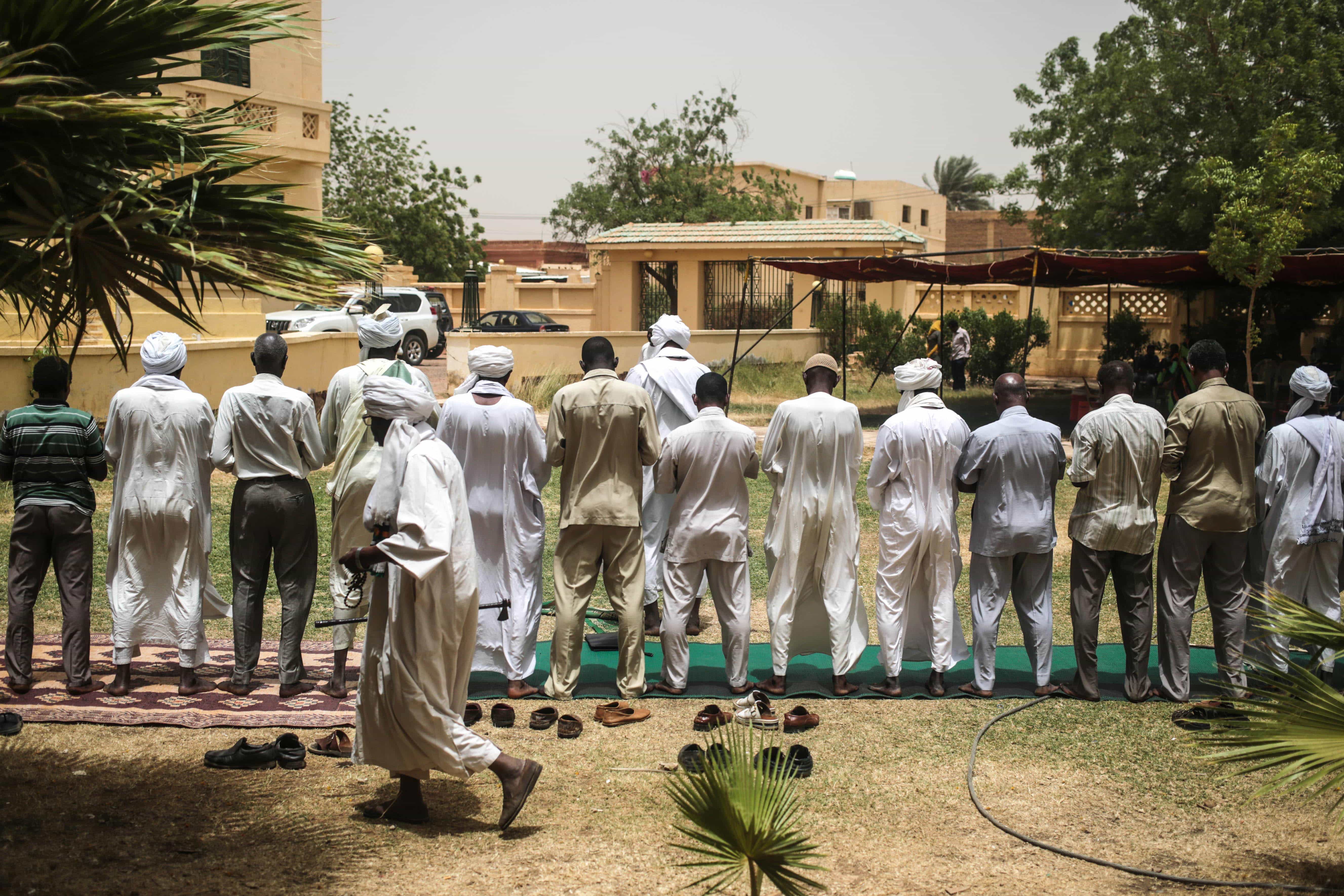 Men pray as Sudanese opposition parties organize a sit-in the headquarters of Umma, one of Sudan’s biggest opposition parties, in Khartoum, 11 April 2015., AP Photo/Mosa'ab Elshamy
