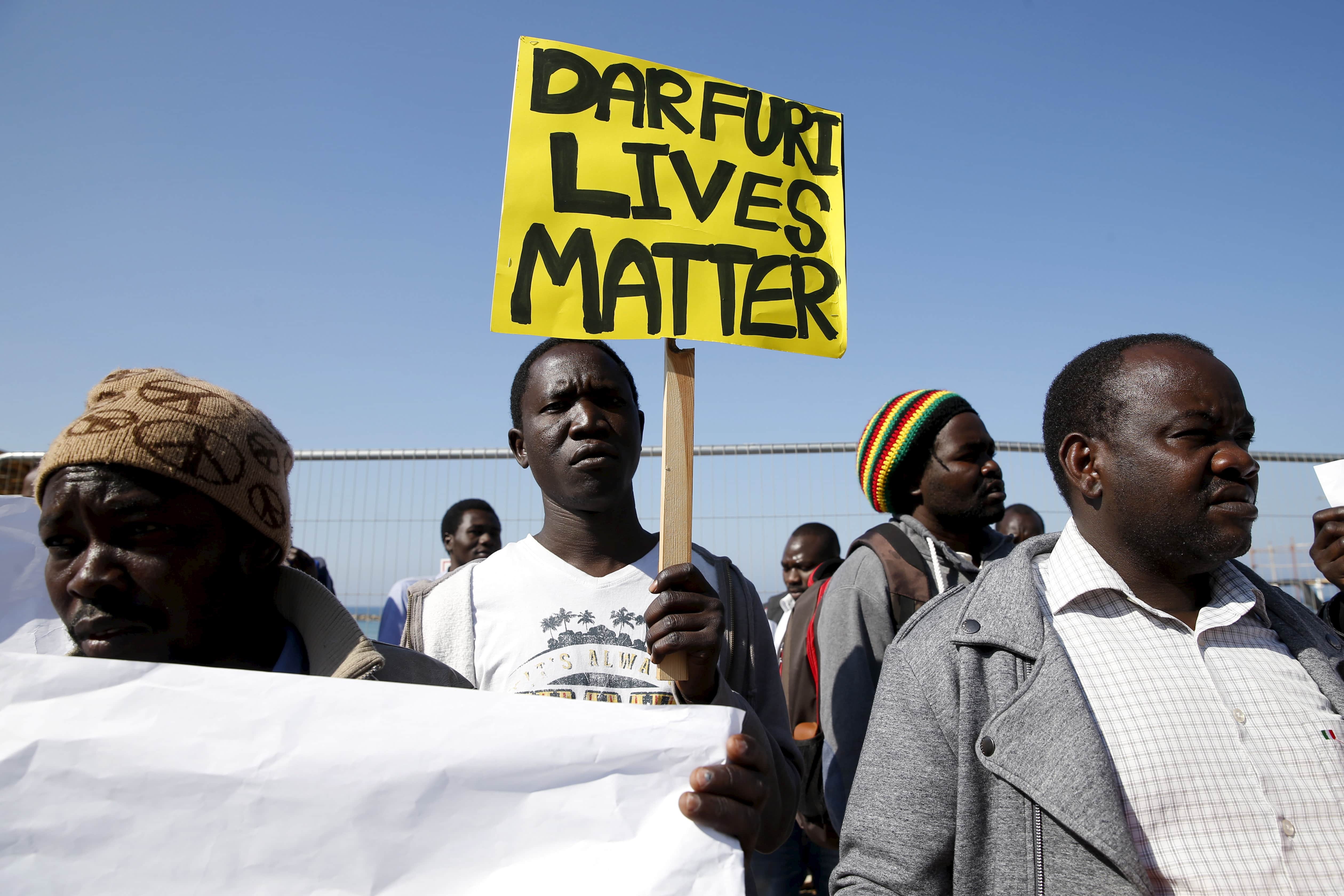 Demonstrators most of whom from Darfur and Sudan hold placards as they protest against human rights violation in front of the American Embassy in Tel Aviv, 3 February 2016, REUTERS/Baz Ratner