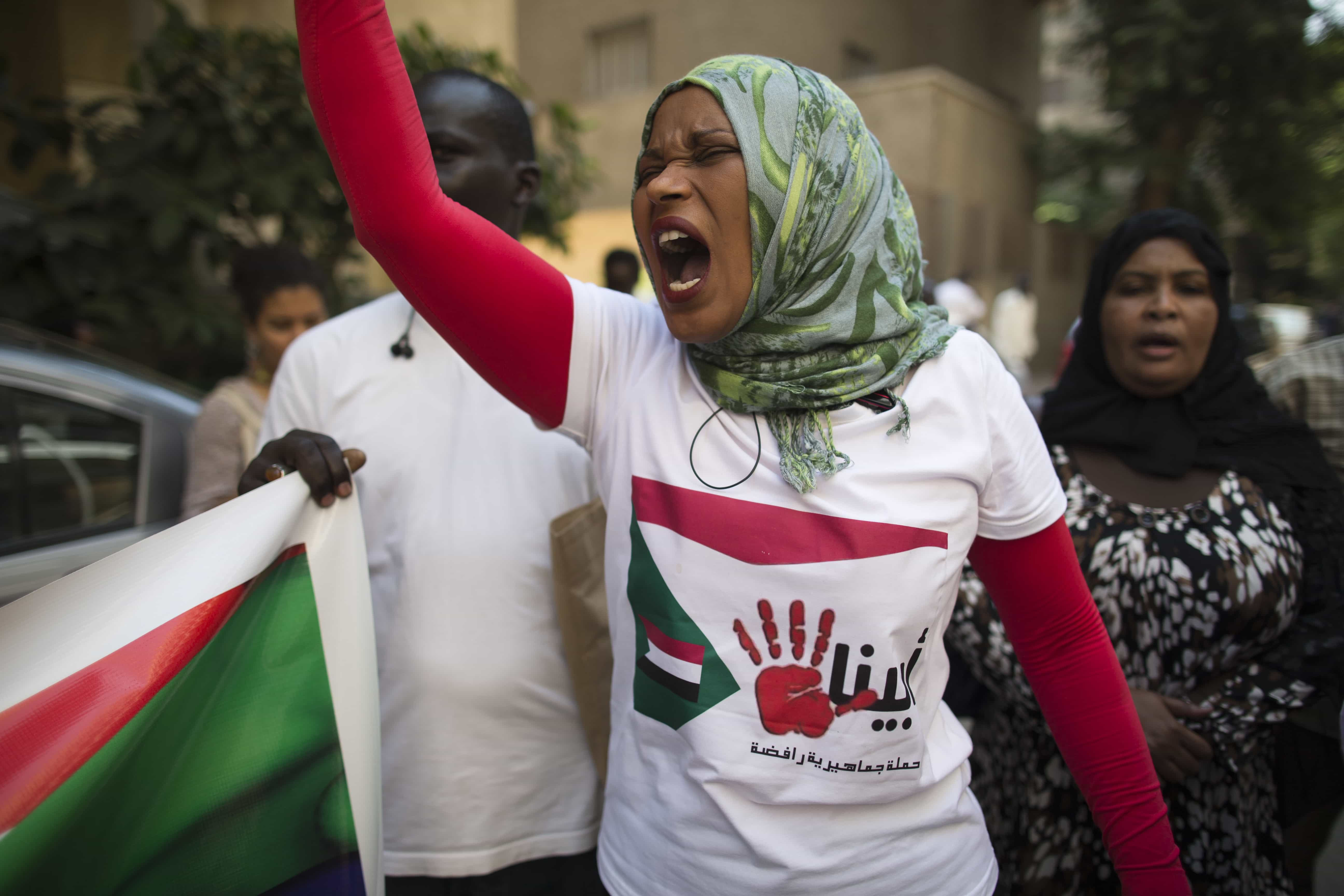 A Sudanese woman chants slogans against longtime President Omar al-Bashir during a protest in front of the Sudanese embassy in Cairo, Egypt, Sunday, Sept. 29, 2013., AP Photo/Hassan Ammar