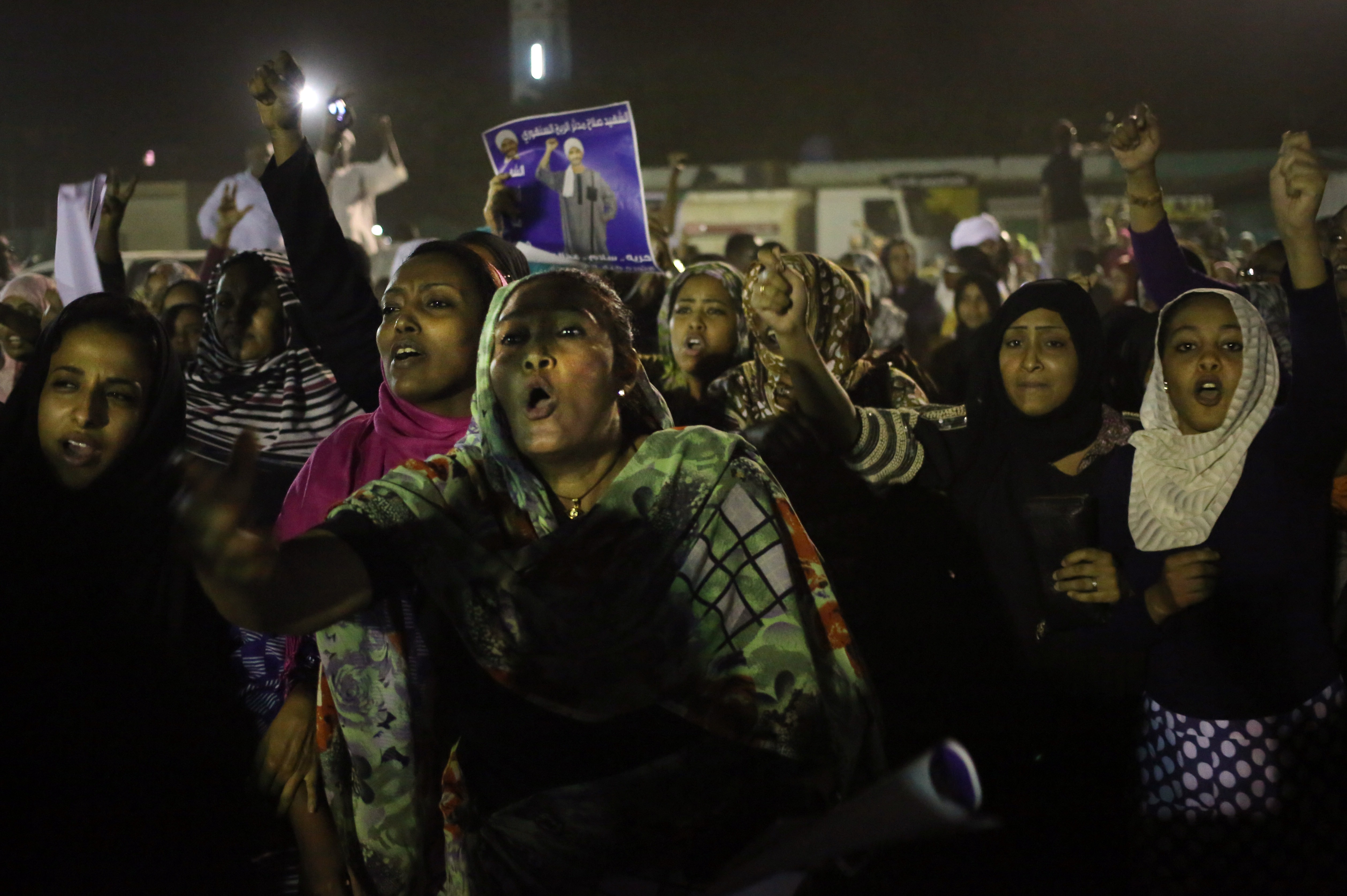 Sudanese anti-government protesters chant slogans during a demonstration in Khartoum, 29 September 2013, AP Photo/Khalil Hamra