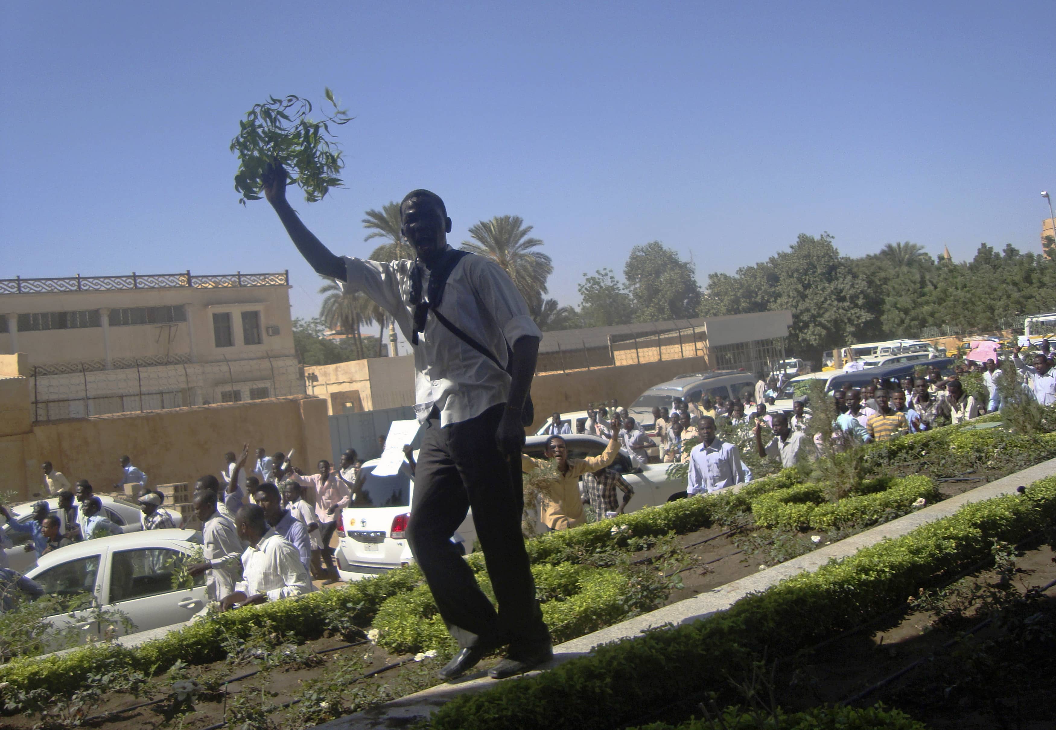 A student demonstrates outside the Ministry of Justice, over the deaths of four students from war-torn western region of Darfur in Gezira state, at Khartoum, 9 December 2012, REUTERS/Stringer